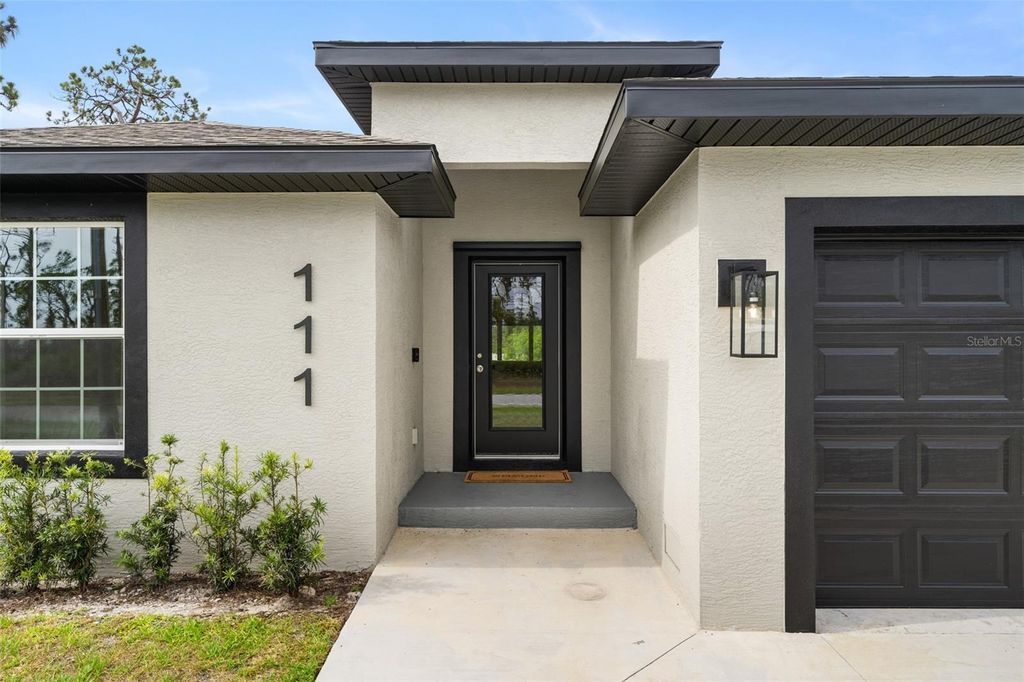 Photo of 111 Sunset Road, Rotonda West, FL 33947 (MLS # A4686328)