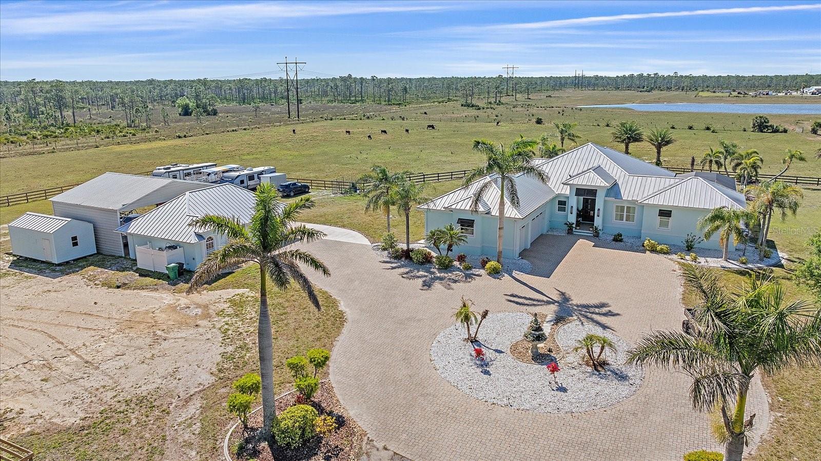 Experience the best of Florida acreage living with this rare opportunity in Punta Gorda, FL. Situated on 18.5 acres of fully cleared land, this property features a modern hurricane-resistant home designed with strength, efficiency, and comfort in mind.
Property Highlights
18.5 Acres of Cleared Land – Perfect for a ranch, equestrian estate, farming, or private retreat.
New Hurricane-Resistant Home – Elevated design built to withstand storms, offering long-term peace of mind.
Self-Sustaining Systems – Includes two private wells, a whole-house generator, and a reverse osmosis water system, making this one of Punta Gorda’s most resilient homes for sale.
Turnkey & Move-In Ready – Modern finishes, open design, and ready for immediate occupancy.
Prime Location – Close to downtown Punta Gorda, Charlotte Harbor, I-75, and Gulf Coast beaches, yet private and serene.
Why Buyers Choose This Property
Large acreage properties in Punta Gorda are highly sought after, and this one is designed for self-sufficiency and modern living. With no HOA restrictions, you have the freedom to create your vision—whether that’s horses, farming, or building additional structures.
This estate delivers the rare combination of land, privacy, and a hurricane-ready home in Southwest Florida.