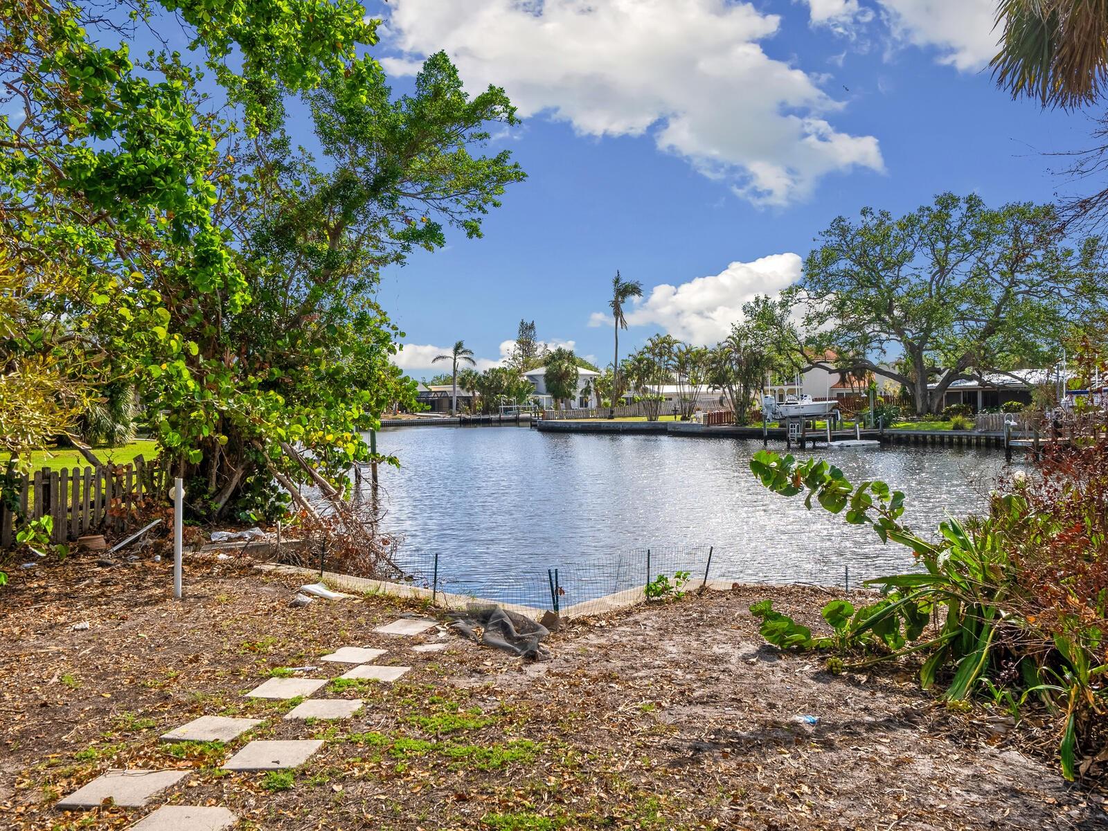 Canal front home on over half an acre, ideally on a quiet street just 1.5 blocks from Siesta Key Village and a short distance to Crescent Beach. The property is being sold as-is. The home did incur water damage due to recent hurricanes. Mold remediation has been performed. This desirable lot is .60 acres, an ideal place to build your dream home.