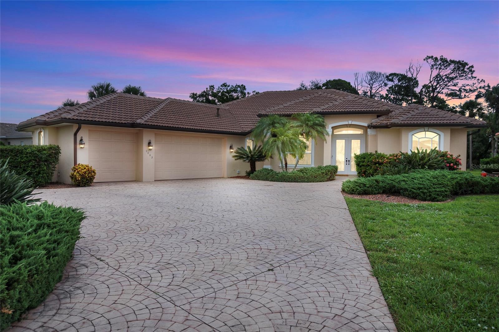 Custom Fero-Built Estate with 3-Car Garage in Bobcat Trail – Ideal for Multigenerational/Accessible Living
Welcome to this exquisite one-owner, custom-built Fero home in the gated Bobcat Trail community of North Port, Florida. Situated on a rare cul-de-sac lot backing to a serene, wooded view, this 2,824 sq ft estate home offers privacy, elegance, and thoughtful design—perfect for multigenerational living.
Featuring 4 spacious bedrooms and 3 full bathrooms, each bedroom includes a walk-in closet. The expansive primary suite boasts two walk-in closets (one with a built-in floor safe) and private lanai access. A guest suite with en-suite bath is ideal for visitors, while a fourth bedroom currently serves as a large home office with lanai access.
Designed for comfort and flow, the home showcases 11-ft ceilings, abundant natural light, and expansive sliders that blend indoor and outdoor living. The formal living room features a natural gas fireplace, complemented by a formal dining room and a stunning family/den area with custom built-ins.
The eat-in kitchen has a gas stove, ample cabinetry, and a 6x4 walk-in pantry. A spacious laundry room offers additional storage and cabinetry. Recent upgrades include a new roof and A/C unit (2024). The home is connected to city water/sewer and includes a dedicated irrigation well and circular driveway for added convenience and curb appeal.
Step outside to the oversized screened lanai with a tranquil koi pond and room to add a pool. The lanai is plumbed for natural gas and water—ready for your dream outdoor kitchen. The oversized 3-car garage provides ample space for hobbies and storage.
This meticulously maintained home includes original blueprints and design plans—ideal for future customization. 2 of the showers are accessible as is the front entry.
Community Highlights: Bobcat Trail is a gated, non-age-restricted community with approx. 450 homes and 110 villas. Amenities include:
Heated community pool
Tennis & pickleball courts
Fitness & recreation center with social activities
Scenic sidewalks and mature landscaping
Don’t miss this rare opportunity to own a truly custom home in one of North Port’s premier communities.