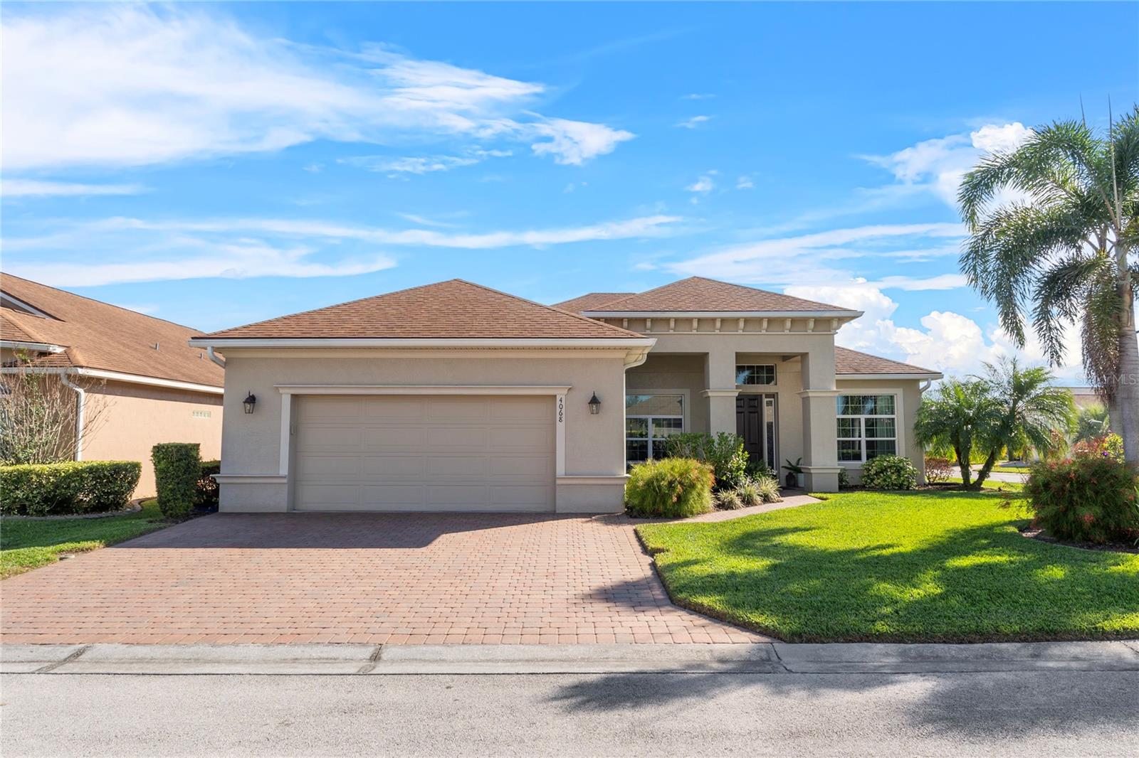 Discover the charm of this stunning Wellington model pool home in picturesque Lake Ashton, situated on a spacious corner lot with a heated saltwater pool! It's one of the few homes in the neighborhood that feature an in-law suite with TV, refrigerator, microwave, sink and countertop. Boasting over 2,000 square feet, this 3-bedroom, 2-bathroom home is filled with premium upgrades, designed for both comfort and entertainment. Step inside to a welcoming entryway that opens to soaring ceilings, elegant double arches, and rich wood-grain tile floors. Off the entrance, there's a versatile bonus space that could be used as a quiet home office, a cozy reading nook, a craft or hobby room, or an extra guest retreat. This flexible area can be tailored to suit your preferences. The expansive living room features triple sliding doors, offering a seamless transition to the outdoor entertainment space and pool area. The chef’s kitchen is both stylish and functional, complete with granite countertops, stainless steel appliances, and a central island perfect for food prep or display. Retreat to the spacious primary suite, which includes an ensuite bathroom with two separate custom walk-in closets, a luxurious soaking tub, a glass-enclosed walk-in shower, and a quartz-topped comfort-height vanity. Step outside to your private oasis, where the heated saltwater pool is enclosed within a screened lanai and surrounded by lush landscaping. The outdoor entertainment area includes a dry bar with a mini fridge, granite countertops, cabinetry and multiple seating areas. Other mentionable features include designer lighting and fans, pocket doors, a Nest thermostat, a separate irrigation meter, landscape lighting, garage storage racks, and additional custom built-in cabinet systems in the laundry room. Lake Ashton is more than just a neighborhood—it’s a true community, where neighbors become friends and there’s always something happening. Designed for those who love an active and social lifestyle, this premier golf community offers a warm and welcoming atmosphere, where residents come together to enjoy the best that Florida living has to offer. At the heart of Lake Ashton is an impressive array of amenities, ensuring that there’s something for everyone. The gated entrance provides both security and exclusivity, while the clubhouse serves as the central hub for social gatherings, activities, and entertainment. Residents can stay active with fitness centers, multiple pools, pickleball and tennis courts, racquetball, shuffleboard, and recreation facilities. Pet lovers will also appreciate the dedicated pet parks where furry friends can socialize and play. With a variety of groups and clubs, there’s no shortage of ways to get involved. From line dancing and card groups to theatre clubs, residents can explore new hobbies and make lasting connections. Those who enjoy fitness and fun can participate in high energy Zumba classes or take a chair yoga class for gentle movement and relaxation. The community also has karaoke and trivia nights throughout the week! And for the golf enthusiasts - Lake Ashton is a golfer’s paradise, boasting premiere golf courses set against a stunning natural backdrop. Don’t miss your chance to own this exceptional home in this beautiful community of Lake Ashton—where luxury, comfort, and community come together. Schedule your private showing today and start living the lifestyle you’ve always dreamed of!