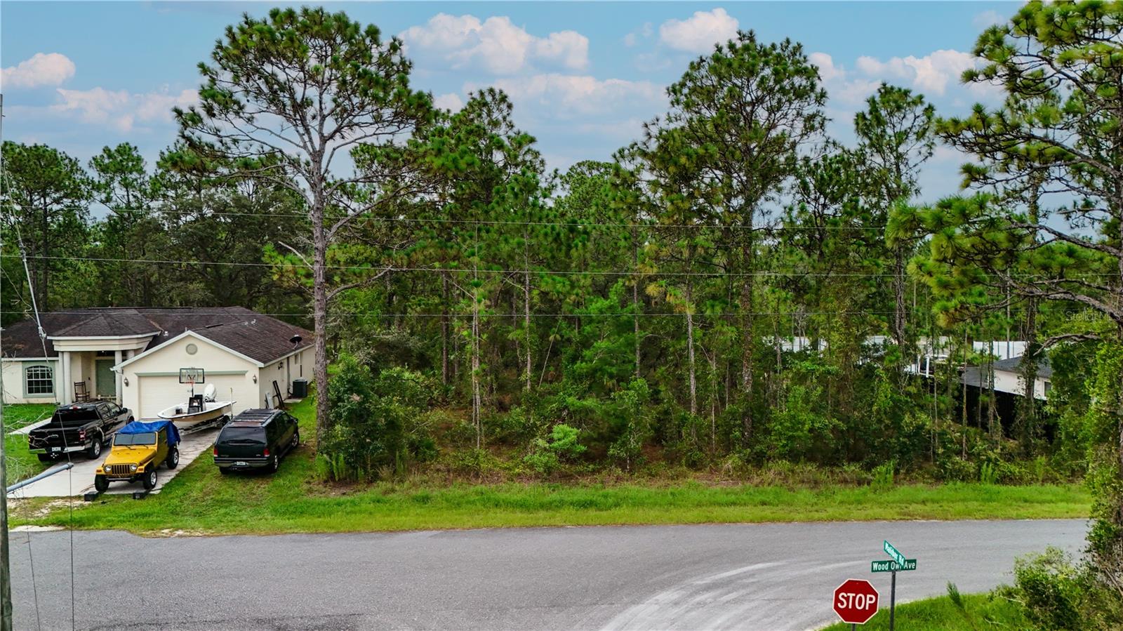 Just off US Highway 19, this 0.5-acre buildable residential lot offers the perfect combination of accessibility and privacy. Enjoy fast access to major routes for commuting, shopping, and dining, while being tucked away on a quiet, paved road that provides a true sense of space. Best of all, the property sits in a NO FLOOD ZONE. Surrounded by newer homes, the area is steadily growing—making this a fantastic location to build your dream home. With NO HOA and no deed restrictions, you have the freedom to design the lifestyle you want, whether that means a custom-built residence, adding a pool, or creating a private outdoor retreat. You’ll be just 10 minutes from the PUBLIX shopping center and only 15 minutes from both WEEKI WACHEE SPRINGS STATE PARK and HOMOSASSA SPRINGS. The Gulf Coast beaches are only 25 minutes away, offering endless opportunities for boating, fishing, kayaking, and exploring Florida’s natural beauty. While conveniently located near top attractions, the property still offers a peaceful, residential setting that feels tucked away from it all. Whether you're planning your forever home, a seasonal escape, or a long-term investment in a fast-developing area, this lot offers outstanding potential and flexibility.