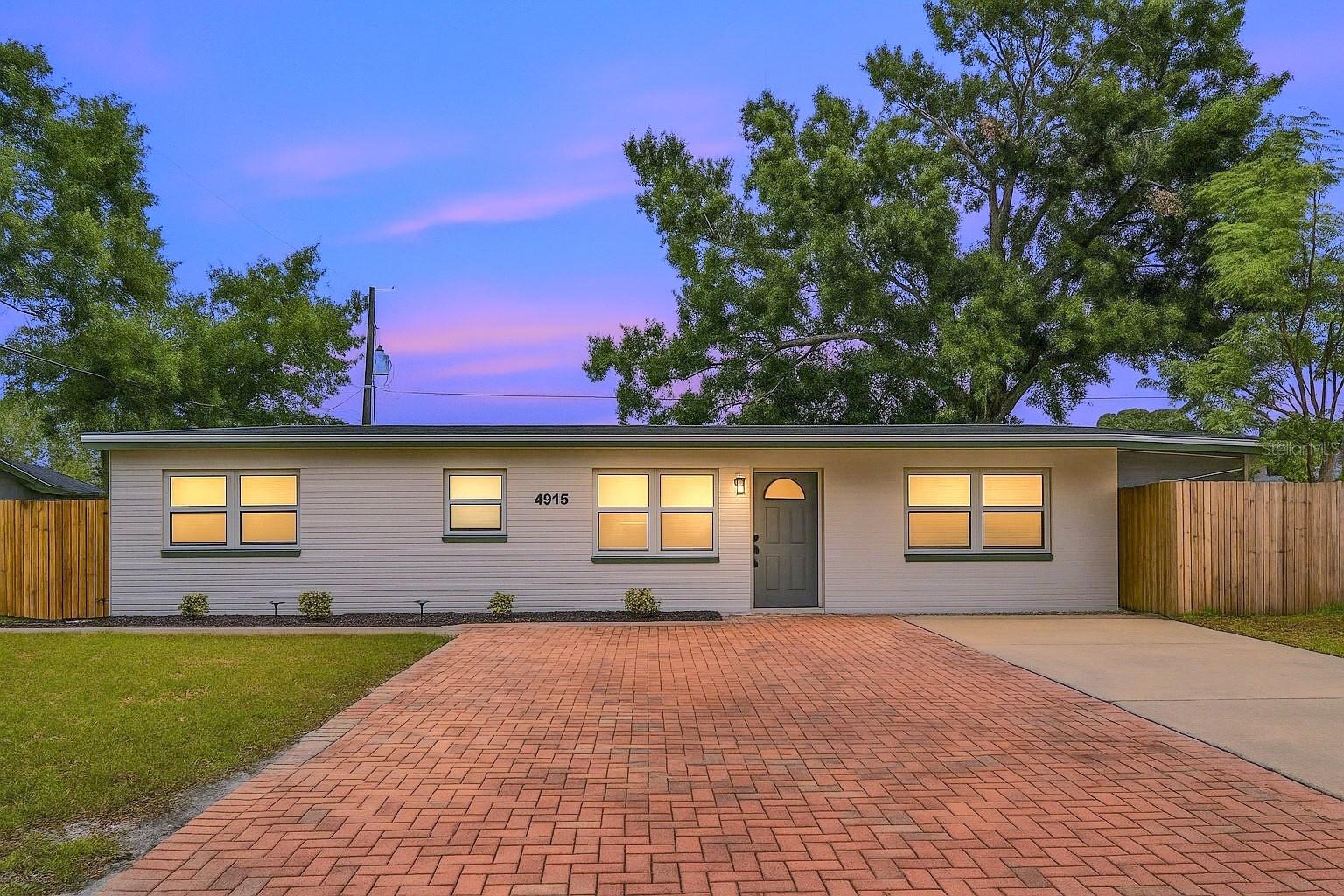 Welcome to this beautifully renovated 4-bedroom, 2-bathroom home located in one of Tampa’s most desirable neighborhoods. Sitting on a fully fenced 0.14-acre lot, this property blends modern upgrades with everyday comfort. From the moment you arrive, you’ll appreciate the gorgeous curb appeal, manicured landscaping, and inviting entryway. Inside, the home features brand-new luxury vinyl flooring, stylish light fixtures, and an open-concept floor plan that’s perfect for both relaxing and entertaining. The updated kitchen boasts stainless steel appliances, quartz countertops, and a sleek contemporary design. Each bedroom is equipped with ceiling fans, large windows, and plenty of natural light. The primary bathroom includes a newly tiled walk-in shower and an upgraded vanity. Additional highlights include a NEW A/C (2025) and NEW Water heater (2025), providing peace of mind for years to come. Conveniently located near the Veteran’s Expressway, this home offers easy access to Tampa International Airport, International Plaza, top-rated schools, and the vibrant downtown Tampa area. Don’t miss the chance to own this stunning, move-in-ready home in one of Tampa’s premier communities.