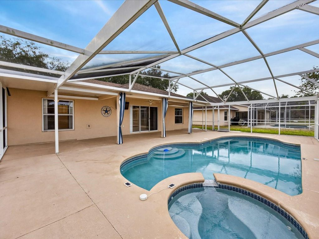 Photo of 703 Sunridge Woods Boulevard, Davenport, FL 33837 (MLS # O6403867)