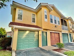This beautiful condo corner unit has it all located in Villanova at Hunter's Creek. Amazing gated community, conveniently located featuring an open space with a covered screened-in balcony, one car garage. Featuring newly installed laminate flooring on the main floor NO CARPET. This condo has it all! Formal living room, dining room and office work space. Amenities abound-resort-style swimming pool, spa, fitness center and clubhouse. Top rated schools, parks, recreational areas, easy access to all major roads, shops, restaurants, MCO airport and world’s best theme parks just minutes away. Make your move to Villanova!