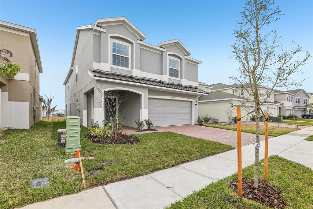 Photo of 1227 Island Slough Lane, Davenport, FL 33837 (MLS # O6365753)