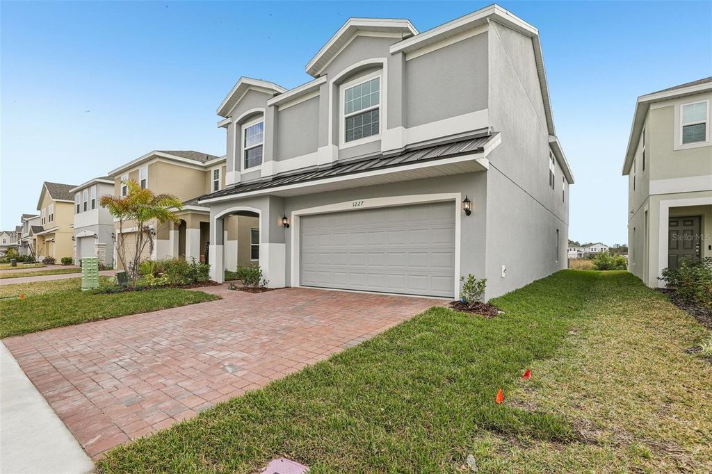 Photo of 1227 Island Slough Lane, Davenport, FL 33837 (MLS # O6365753)