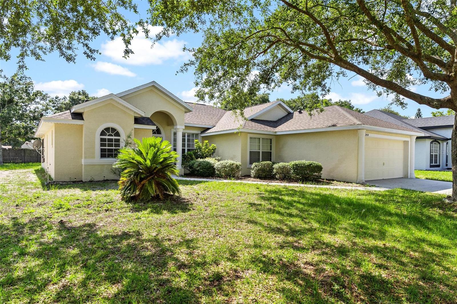 Great Location Between Eustis & Mount Dora! You’ll love the convenience of this custom-built home, located just minutes from both Eustis and Mount Dora, where there’s plenty of shopping, dining, and entertainment to enjoy. This home features vaulted ceilings and a bright, open layout. The kitchen offers plenty of cabinet space, a glass cooktop, closet pantry, and a breakfast bar that opens to the family room. Sliding doors lead to a large 30x11 screened-in porch—great for relaxing or entertaining. The formal living and dining rooms are located off the tiled foyer, perfect for hosting. The spacious master suite includes sliding doors to the porch, two walk-in closets, and a private bathroom with double sinks, a garden tub, and a walk-in shower. There are three guest bedrooms and a second full bathroom with a tub/shower combo. You'll also find an inside laundry room, a 2-car garage with electric opener, and a nicely shaded yard with a sprinkler system.