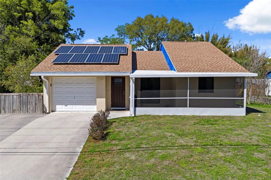 Welcome to this charming Florida retreat, where comfort, efficiency, and effortless outdoor living come together beautifully. This well-maintained home features a bright, open-concept layout filled with natural light, creating a warm and inviting atmosphere from the moment you step inside.

The spacious living area seamlessly connects to the kitchen, offering ample cabinetry and generous counter space perfect for both everyday living and entertaining. The home includes two comfortable bedrooms, highlighted by a private primary suite with an en-suite bath for added convenience and relaxation.

Step outside to your own private oasis, complete with a screened-in lanai and sparkling pool ideal for unwinding or hosting guests year-round. The fenced backyard provides plenty of space for pets, play, or gardening, along with a convenient storage shed.

Recent upgrades add even more value and peace of mind, including a new roof (2023) and impact-resistant storm windows (2018). Additional features include solar panels for enhanced energy efficiency, a one-car garage, and a quiet residential setting surrounded by mature trees while still being just minutes from shopping, dining, and Florida’s stunning Gulf Coast beaches.