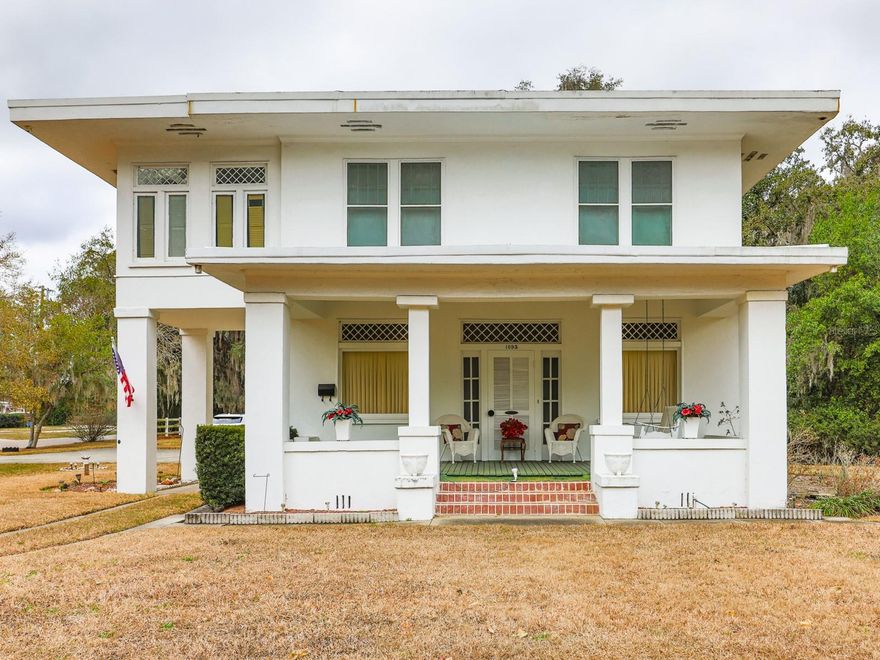 This home was inspired by a Frank Lloyd Wright design! Lovely historic home in the heart of Bartow, full of charm, character, and opportunity! This 109-year-old landmark property sits proudly on a 1.32-acre corner double lot at Broadway and Stuart, offering incredible potential. With the option to split the lot and build, you can create the workshop of your dreams, expand, or simply enjoy the extra space and privacy.

Perfectly located to Bartow High School and its stadium, Bartow Middle School, Floral Avenue Elementary School, the Bartow Civic Center, and the Bartow Public Library—all accessible by sidewalks. Downtown Bartow, Mary Holland Park, and Nye Jordan Park are just a mile away, making this location as convenient as it is charming.

The home itself showcases timeless architectural details, including a large front porch perfectly positioned along the local parade route. Inside, you’ll find 9-foot ceilings, impressive 8-inch baseboards, original hardwood floors throughout most of the home, and some original leaded glass windows complemented by double-pane updates. Natural light fills the spacious layout designed for comfortable multi-generational living.

The main level features a formal living room and dining room, a kitchen with butler’s pantry, a convenient half bath, and a defined Florida Room with beautiful pebble stone flooring—an ideal space to enjoy your morning coffee. French doors open into the Florida Room, creating seamless flow for entertaining. Upstairs offers 3 bedrooms and 2 full baths. A one-car enclosed garage adds functionality, while mature oak trees and natural vegetation enhance the property’s classic Florida beauty.

Restaurants, shopping, banking, medical offices, and hospitals are all just minutes away.

This is a rare opportunity to own a true Bartow landmark with space, flexibility, and historic elegance.