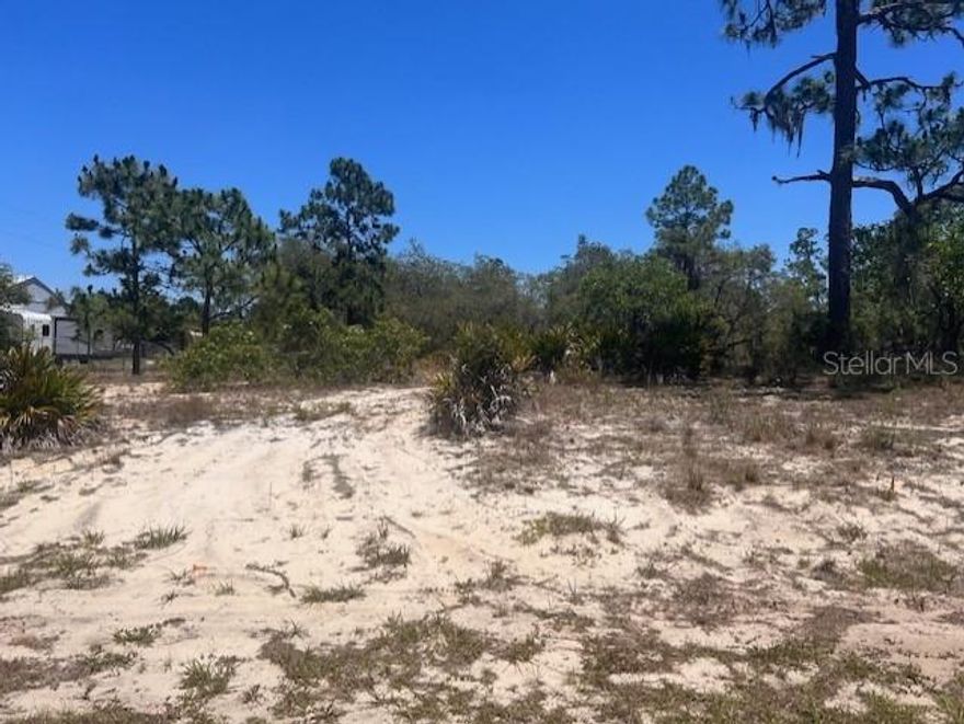 Build your dream home on this half acre lot Walk-In-Water Lake Estates Subdivision. Manufactured, mobile homes or modular homes are not allowed per deed restrictions.  There is an low cost optional HOA membership that gives you access to Lake Weohyakapka, boat ramp, fishing dock, clubhouse, tennis courts and park/picnic area.