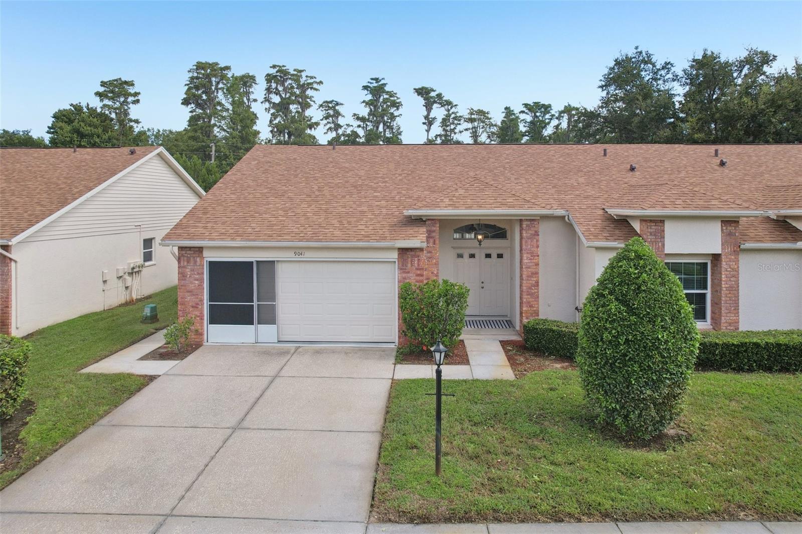 Terrific and move-in ready home in the Heritage Lakes amenity-rich 55+ community! This immaculate end-unit condo offers exceptional comfort and privacy.
From the moment you step inside, you’re welcomed by cathedral ceilings in the living room and primary suite, creating a spacious and airy atmosphere. Natural light filters through elegant plantation shutters, highlighting the neutral interior and the home’s inviting open layout.
The well-appointed eat-in kitchen features newer stainless steel appliances (2020). An inside utility room with laundry tub adds convenience, while the upgraded AC (2019) and garage door with screens (2020) provide peace of mind.
A true retreat, the primary suite offers dual walk-in closets and a private bath, while the guest bedroom also features its own walk-in closet for generous storage. Step outside to the large, private back patio with tranquil views of lush greenery—perfect for relaxing or entertaining.
Located in a vibrant 55+ community, residents enjoy an active clubhouse, heated pool, and proximity to shopping and dining.
With its prime location, thoughtful updates, and exceptional upkeep, this property is an outstanding opportunity for refined, low-maintenance living. Schedule your private showing today.