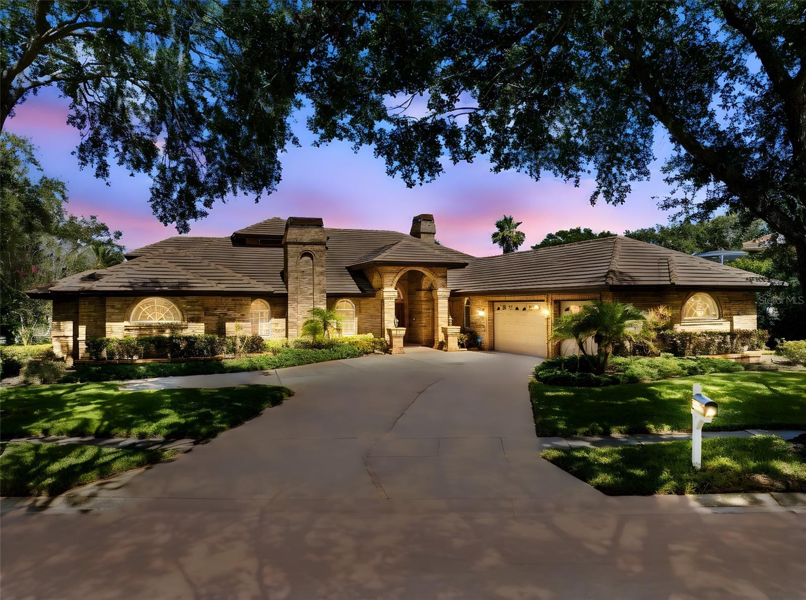 Welcome to Cobb’s Landing — one of the most coveted and upscale neighborhoods in Palm Harbor, where luxury living meets an exclusive sense of community. Nestled among multi-million dollar homes and mature tree-lined streets, this distinguished residence offers refined elegance and a rare opportunity to own in a location where few properties come available.
This stately 4 bedroom + office, 4 bathroom home features a spacious 3 car garage and timeless architectural character throughout. From the moment you enter, you’re greeted by sky-high ceilings and expansive living spaces with genuine Italian marble floors (yes, flown in from Italy!). A thoughtfully designed layout offers both impressive entertaining areas and comfortable everyday living, with a desirable split bedroom floor plan that ensures privacy and functionality. The primary suite is a true retreat, featuring a sizable bedroom with a unique elevated flex space perfect for a second office, reading nook, or fitness area overlooking the pool.
The home’s classic charm blends with enduring luxury: custom wood built-ins, graceful archways, and grand architectural lines create a commanding presence ideal for both entertaining and everyday living. A dedicated home office offers quiet productivity, while the main living areas connect to a truly unique outdoor space.
Three sets of French doors draw your eye outdoors to a private screened-in lanai featuring a sparkling pool with spa, surrounded by greenery and framed by a vaulted enclosure. The Brazilian wood ceiling above the covered patio adds warmth and charm to the inviting seating areas. Additional highlights include an outdoor kitchen, a pass-through window to the interior kitchen for indoor-outdoor living, and a convenient pool bathroom with full shower.
Peace of mind is built in with solid brick exterior construction, hurricane-rated garage doors (newer install) and concrete tile roof replaced in 2009, known for its durability and an expected lifespan of 50+ years. Positioned in a NON Flood Zone, no flood insurance required.
Located in a community designed for the active lifestyle, enjoy access to the private boat launch and lakefront marina, boat dock rentals, park with walking trails and a pond with a dock and water fountain. Additional amenities include playground, basketball and tennis courts as well as neighborhood events such as golf cart parades on holidays. Zoned for top-rated schools including Palm Harbor University High and close proximity to shopping, dining, the Pinellas Trail, beaches, golf courses, and two airports.
This is not just a home, it’s a legacy property with bones of distinction and room for your personal vision. Opportunities in this neighborhood are rare, schedule your private showing today.