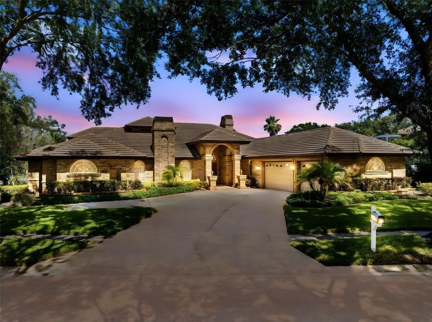 Welcome to Cobb’s Landing — one of the most coveted and upscale neighborhoods in Palm Harbor, where luxury living meets an exclusive sense of community. Nestled among multi-million dollar homes and mature tree-lined streets, this distinguished residence offers refined elegance and a rare opportunity to own in a location where few properties come available. 

This stately 4 bedroom + office, 4 bathroom home features a spacious 3 car garage and timeless architectural character throughout. From the moment you enter, you’re greeted by sky-high ceilings and expansive living spaces with genuine Italian marble floors (yes, flown in from Italy!). A thoughtfully designed layout offers both impressive entertaining areas and comfortable everyday living, with a desirable split bedroom floor plan that ensures privacy and functionality. The primary suite is a true retreat, featuring a sizable bedroom with a unique elevated flex space perfect for a second office, reading nook, or fitness area overlooking the pool. 

The home’s classic charm blends with enduring luxury: custom wood built-ins, graceful archways, and grand architectural lines create a commanding presence ideal for both entertaining and everyday living. A dedicated home office offers quiet productivity, while the main living areas connect to a truly unique outdoor space.

Three sets of French doors draw your eye outdoors to a private screened-in lanai featuring a sparkling pool with spa, surrounded by greenery and framed by a vaulted enclosure. The Brazilian wood ceiling above the covered patio adds warmth and charm to the inviting seating areas. Additional highlights include an outdoor kitchen, a pass-through window to the interior kitchen for indoor-outdoor living, and a convenient pool bathroom with full shower.

Peace of mind is built in with solid brick exterior construction, hurricane-rated garage doors (newer install) and concrete tile roof replaced in 2009, known for its durability and an expected lifespan of 50+ years. Positioned in a NON Flood Zone, no flood insurance required. 

Located in a community designed for the active lifestyle, enjoy access to the private boat launch and lakefront marina, boat dock rentals, park with walking trails and a pond with a dock and water fountain. Additional amenities include playground, basketball and tennis courts as well as neighborhood events such as golf cart parades on holidays. Zoned for top-rated schools including Palm Harbor University High and close proximity to shopping, dining, the Pinellas Trail, beaches, golf courses, and two airports. 

This is not just a home, it’s a legacy property with bones of distinction and room for your personal vision. Opportunities in this neighborhood are rare, schedule your private showing today. A recent 4-Point inspection has been completed and passed, available for buyer review upon request.
