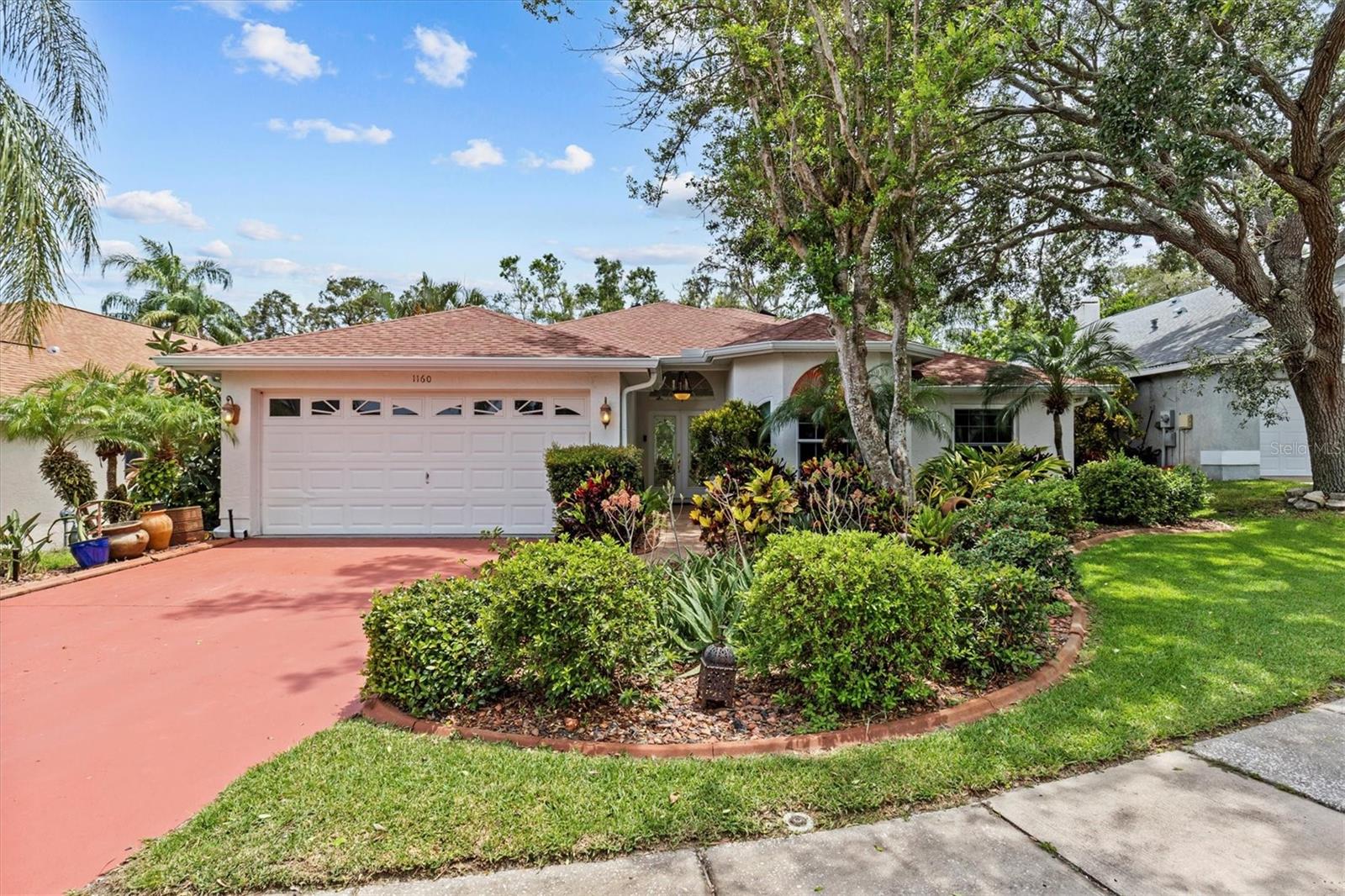 Fresh new price on this beautiful home—don’t miss your chance! Welcome to your private oasis in the heart of Tarpon Springs! This beautifully upgraded 4-bedroom, 3-bathroom home with a 2-car garage is perfectly nestled on a wooded lot offering peace, privacy, and natural beauty. Located in a quiet, well-maintained neighborhood just minutes from Fred Howard Park and Beach, Sunset Beach, the world-famous Sponge Docks, historic downtown Tarpon Springs, and local golf courses. Enjoy year-round outdoor living with a heated saltwater pool and spa, surrounded by lush landscaping and a built-in outdoor kitchen—perfect for entertaining! Inside, you'll find thoughtful upgrades throughout, including a full-house GenerX generator for peace of mind during any storm. This home truly has it all! Be sure to ask for the full list of upgrades—you won’t want to miss all the features that make this home a standout. This is Florida living at its best—don’t miss your opportunity to own a slice of paradise!