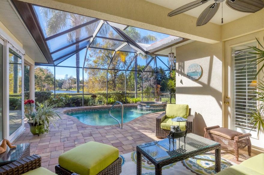 A captivating lake view with mature trees draws you in the moment you step inside this Lee Wetherington–built Paloma model, ideally positioned on 1/3 of an acre with ownership extending to the water. Featuring a new 2025 roof, pool and spa, full-house generator, 3 car garage, 11‘ ceilings, crown molding and access to Lakewood Ranch Country Club and Legacy Golf Course, this residence offers refined Florida living with timeless appeal in the gated Lakewood Ranch Country Club Community.

From the moment you arrive, the home shares a rare sense of tranquility, where expansive lake views and natural surroundings become the defining focal point of daily living. The oversized homesite creates both openness and privacy, offering a setting that feels serene, established, rich in natural beauty.

The interior is designed with thoughtful separation of spaces giving great privacy to the 4 bedrooms. The main salon, oriented directly to the lake, is inviting and cozy. The kitchen family room area has sliding impact glass doors opening to the pool patio space allowing a free flow of movement on those perfect Florida days. The kitchen enjoys a large island, breakfast nook, and 2 walk-in pantries! A quiet hallway behind the kitchen leads to 2 bedrooms and a full hall bath well suited for friends, children, visiting children and grandchildren. A delightful junior suite is tucked away just off the family room with access to the pool patio. The primary suite enjoys tranquil lake and patio views, generous closet space with multiple walk-in and side closets, and a sun-filled bath with dual vanities, water closet, and separate shower. Then there is the surprise of yet another room we call ‘the sanctuary’ a quiet escape when one needs to exhale!

Outdoor living is designed for year-round enjoyment, with pool and spa, expansive paver patio, and 2 covered seating areas, all enclosed within a screened cage. The land extends down to the lake with extra lawn area for your enjoyment.

With access to the lifestyle amenities of Lakewood Ranch Country Club and Legacy Golf Course, this residence represents an exceptional opportunity to enjoy refined, relaxed living in one of Lakewood Ranch’s most established and naturally beautiful settings. All the conveniences of everyday living, dining, shopping are close by. Lakewood Ranch also enjoys outstanding schools and athletic facilities. Greater Sarasota is also famous for its white sandy beaches and its reputation as the “Cultural Coast of Florida”.