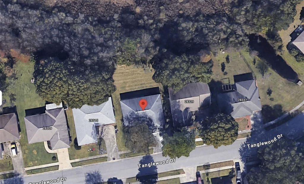 Photo of 28321 Tanglewood Drive, Wesley Chapel, FL 33543 (MLS # J992497)