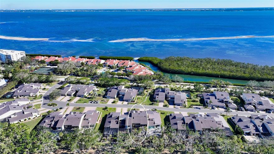 Discover this exquisitely renovated condo with high-impact windows and sliders that lives like a single-family home!  This fully furnished 3-bedroom, 2-bath home in the friendly “Harbour Oaks” section of the prestigious Bay Isles community on Longboat Key comes with a private 2 car garage. With just under 2,000 square feet of living space, this residence perfectly combines luxury, comfort, and convenience. This home has been meticulously designed with high-end finishes by an interior designer, offering a sophisticated aesthetic throughout, featuring custom wood paneling, recessed lighting, engineered wood floors, Stark wool carpet in the primary bedroom, and custom window treatments. The 2020 upgraded kitchen features premium stainless-steel appliances and an induction range. Additional thoughtful design elements include cove lighting in the dining room and a wood-burning fireplace with custom Carrera Marble surround. The lanai with a motorized no-see-um bug screen overlooks the Longboat Key Club Harbourside Golf Course, providing breathtaking and comfortable sunset views framed by beautiful trees and lush greenery. For safety, durability and financial peace of mind, this gorgeous second floor residence features recently upgraded high-impact sliders and windows, plus community-wide new roofing and siding. Located in the gated Bay Isles community with 24/7 security, this home is within walking or biking distance to the private and newly renovated Bay Isles Beach Club, the Longboat Key Club Moorings Marina and Portofino restaurant, the Longboat Key Club Pickleball and Tennis Courts, Publix, CVS, as well as to the new Longboat Key St. Regis, which offers exceptional dining options and the vibrant St. Regis Monkey Bar, now open to the public. This remarkable turn-key property with a beautiful community pool and spa offers a rare opportunity to embrace the unparalleled Longboat Key lifestyle. Don’t miss the chance to make it your own.