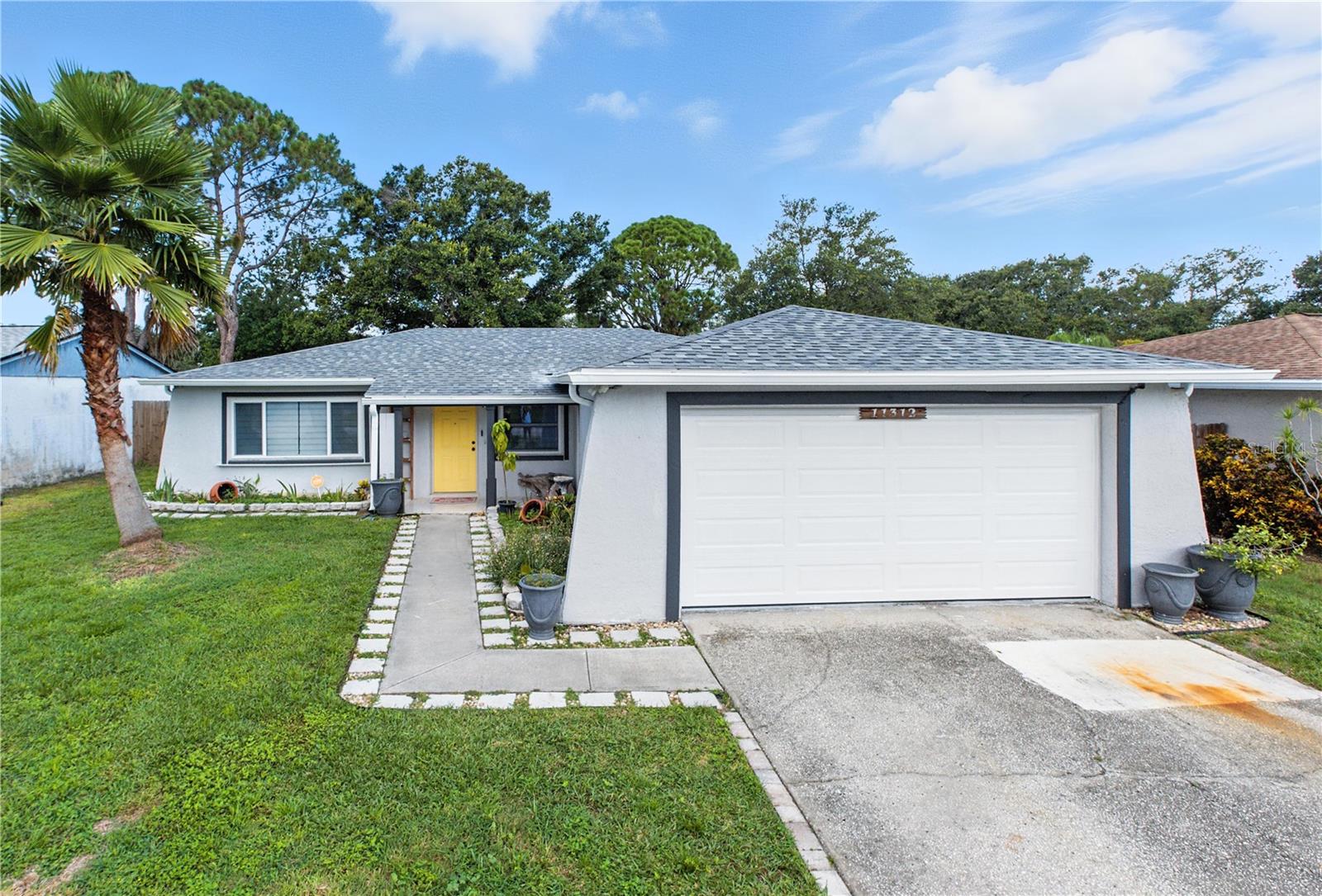 Charming 2-bedroom, 2-bathroom home with a spacious garage and a versatile bonus room...perfect for a home gym, office, or whatever suits your lifestyle. Nestled in a serene, family-friendly neighborhood, this home has experienced no storm damage. Enjoy the convenience of being just minutes from I-275, shopping, parks, and the beautiful Gulf beaches. Please note, the home is tenant-occupied until September 1st. Featuring a newer A/C (2023) and a new roof (2024), providing added peace of mind.