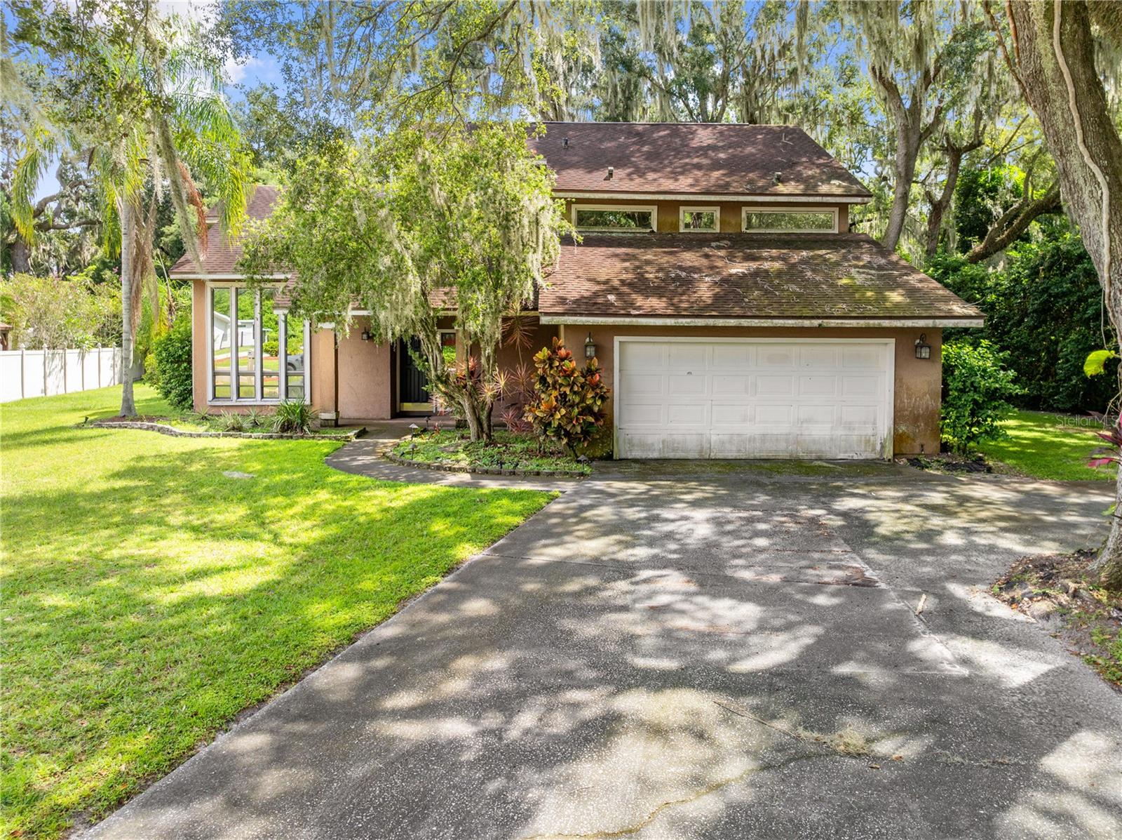 INVESTOR OFFERS WELCOME! This grand old home needs TLC and a new family to give it a face lift.
FOUR bedrooms, THREE full baths, screen enclosed pool and spa on a 0.35 acre fenced lot. The home
features a wet bar in the family room, an inside laundry room and a wood burning fireplace.. Two entrances to the primary suite, one set of spiral stairs from the lanai and through the main house up the stairs. This home boasts 2760 square foot of living area, both a/c units have been replaced, upstairs 2016, downstairs 2021. ALL REASONABLE OFFERS WILL BE CONSIDERED.