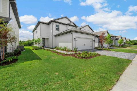 Photo of 1301 Reunion Village Boulevard, Kissimmee, FL 34747 (MLS # TB8441318)