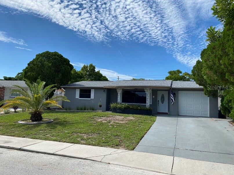 Don’t miss out on this updated pool home. The details inside and outside of this home, is what makes it stand out from the rest! Everything has been updated within the last 2 years.
Gorgeous landscaping and fresh exterior paint. Newer flooring throughout the home. Open layout- with a bonus family room in the back of the home. The beautiful kitchen features grey cabinets, exotic granite countertops, decorative backsplash, newer appliances, and a farmhouse sink. The dining area has a built-in table, which has matching granite and cabinets from the kitchen and a decorative light fixture. The split floor plan gives the main bedroom in the back of the home privacy. It features barn doors and a private FULL Bathroom. The bathroom is updated with newer shower tile. The other two bedrooms and full bath are towards the front of the home. The guest bathroom is completely updated and features newer bathtub, shower tile, vanity, antifog/touch multi-setting mirror and decorative light fixtures. The large back yard is fully fenced in with vinyl fencing for privacy. The enclosed porch and pool are screened in. The saltwater pool was resurfaced in 2020. One car garage with epoxy floors for a cleaner look, new garage door and new washer & dryer for tenants use. A widen driveway gives more room for vehicles. The home has double insulation in the attic.
The shed on the property is EXCLUDED!