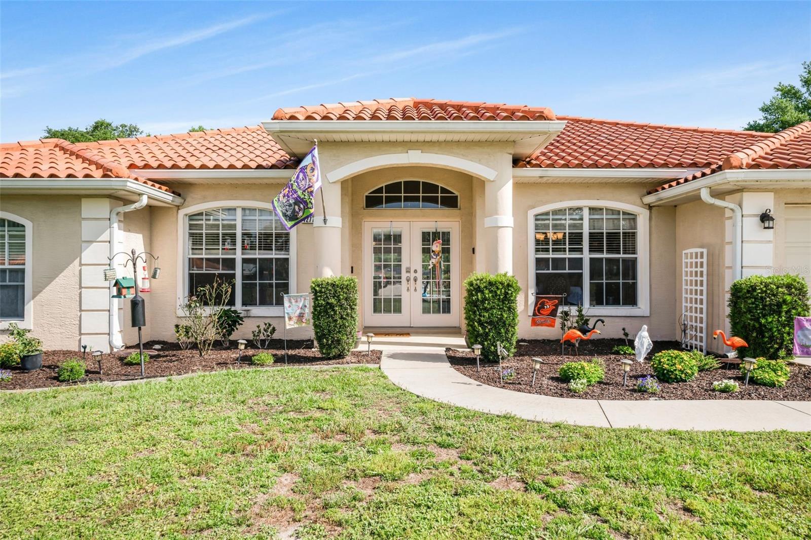 Beautiful Mediterranean style, ready to move in, 4 bedroom, 3 bath, pool home with a 2 car garage home, situated on 0.45 acre lot. The lot directly behind the house is a retention pond. No building behind you. This 2008 built home has red tile roof. NEW LVT throughout the house except for 3 bedrooms; they are carpeted. Coming into the house, you will see two rooms, left and right. Many possibilities to use these rooms; formal living, dining, office, playroom, etc. etc. Large living room with a beautiful fireplace, recently redone with a state-of-the art electric fireplace. The breakfast nook off the kitchen offers a view over the pool. Large kitchen bar, new (gas) stove, microwave, refrigerator, instant hot water at the sink and trash can is hidden in the cabinet. Kitchen and bathrooms have solid granite countertops. One bedroom can be closed off from the main living area and has its own bathroom with access to the pool. Two guest rooms use the guest hall bath. One bedrooms is used for quilting and can be put back to its original state. The master bedroom features tray ceilings and has access to the pool. Large walk-in closet! Bedrooms have carpets. Lots of new light fixtures & fans, all new handicap height toilets. New cabinets in the laundry room for more storage. The lanai has new fans and lights. The pool has been converted to a salt water pool with an electric pool heater. A new "on the demand hot water heater" has been installed for instant hot water. Large 12x36 shed next to the house (permitted) with 60 amp 220 electric service and is climate controlled. Very light and spacious house with an open floor plan. This community is located next to our famous Rails to Trails (Withlacoochee) which is 46 miles of hiking and biking; 5 minutes drive to shopping, restaurants, medical, downtown Inverness, access roads to Ocala, Homosassa, Crystal River and I-75. Citrus County is known for its manatees, lakes, rivers, Gulf of Mexico, hiking, biking, many golf courses, events, and "small town living".