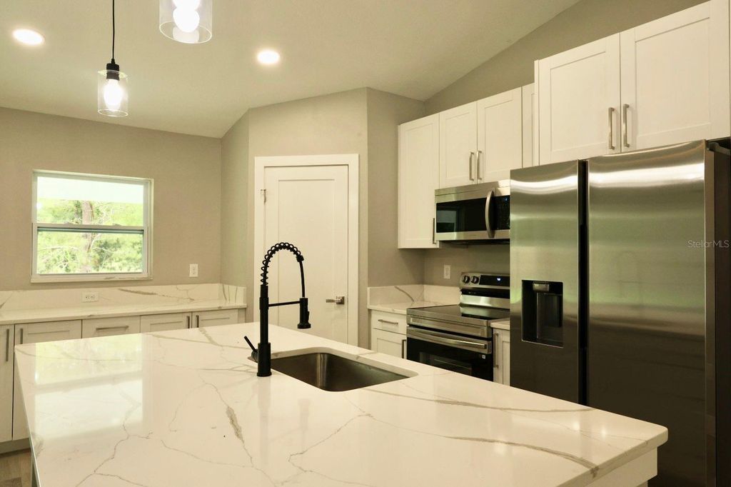 Photo of 138 Guava Pass Terrace, Ocklawaha, FL 32179 (MLS # O6350532)