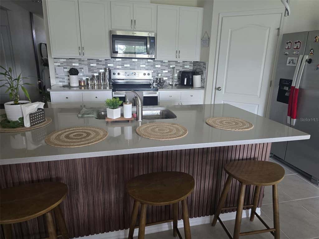 Photo of 3045 Tobago Drive, Haines City, FL 33844 (MLS # S5155478)