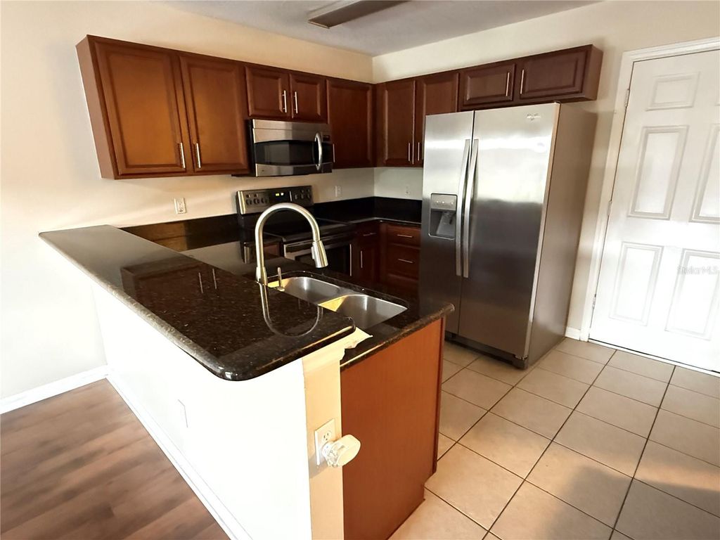 Photo of 584 Cresting Oak Circle #22, Orlando, FL 32824 (MLS # O6422851)