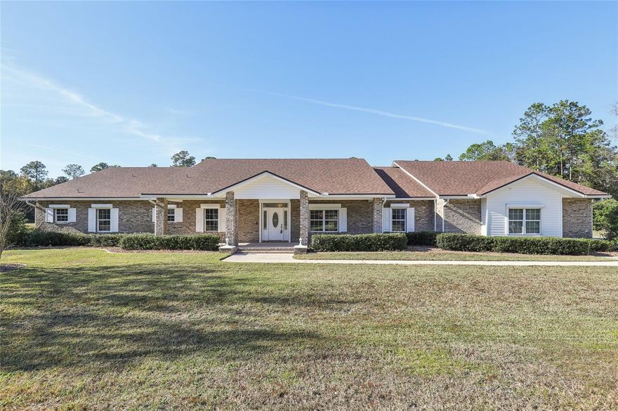 Welcome to 201 Towers Ranch Dr, a rare 4-acre horse property in Saint Augustine offering the perfect blend of privacy, functionality, and elevated Florida living. This concrete ICF construction pool home sits on a sprawling, picturesque waterfront lot with peaceful pond views, giving you room to breathe and space to enjoy a true country lifestyle. After embracing the lifestyle, step inside to discover an impressive interior and a spacious open-concept layout featuring hardwood flooring throughout, a primary suite with attached office/nursery and safe room, four bedrooms each with its own ensuite bath and walk-in closet, two separate living areas, and a laundry/mud room with abundant storage. A 4-car garage with two additional storage rooms ensures plenty of room for vehicles, tools, and toys. Step outside to your own private oasis with a sparkling saltwater sport pool and an expansive lanai designed for year-round enjoyment. The property also includes a versatile detached 3-car garage ideal for equipment storage, a workshop, or additional vehicle space. Designed with every detail in mind, the home is equipped with hurricane shutters and a full-home generator for maximum peace of mind. Perfect for equestrian use or anyone seeking wide-open space, this exceptional property offers endless opportunities to create the lifestyle you've been dreaming of. From its thoughtful concrete ICF construction to its unmatched acreage, 201 Towers Ranch Dr delivers the best of comfort, durability, and rural charm  all while being conveniently located near St. Johns County A-rated schools, shopping, restaurants, I-95, and the World Golf Village.