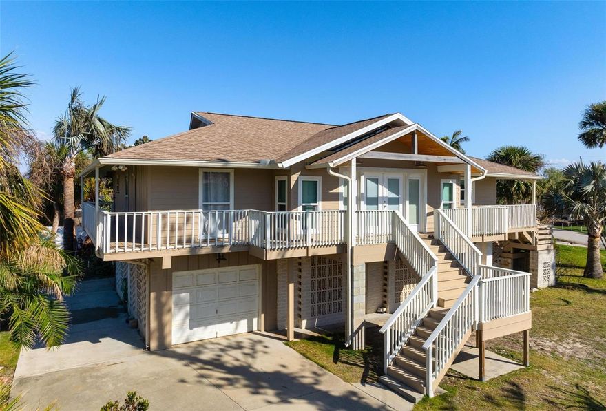 Welcome to your Beach House!  This beautifully renovated home offers serene views of the Gulf of Mexico and is just a short walk to Golden Beach easement. This Key-West inspired elevated home has a complete wrap around walkway! The remodeled kitchen, includes an amazing brick floor, stainless appliances, custom cabinets with soft close, a coffee bar and a pantry. The quaint dinette area is just off the kitchen and is part of the Great Room. Check out the vaulted ceilings, a decorative floor to ceiling fireplace, ample space for lounging and double French doors which open to the large covered deck built to hurricane codes, allowing the gulf breeze flow thru! Each bedroom has its own renovated bath for privacy. Laminate wood flooring runs throughout the living and bedrooms. The huge covered deck off the back of the house is additional exterior living space as you will spend many hours relaxing amongst nature. Ascend to the upper deck and take in the Gulf view! Both spaces are amazing for entertaining as well as kicking back! The ground floor houses a one car garage with another two bays for a workshop, work out room or storage. No water damage from hurricanes!  The front and back French doors are hurricane rated and there is protection for the remaining windows.  Very quiet, innovative 3 mini split system for the a/c and heat pump which cools and heats evenly and is very energy efficient.  Just set the temp and forget it. Should you join the Golden Beach HOA for $50/yr, additional benefits are: parking for cars and carts, bicycle racks, guest privileges, beach access benches, and Gazebo with picnic tables and beach shower. Enjoy the Island lifestyle with its quaint shops, outside cafes, live theater, and much more.