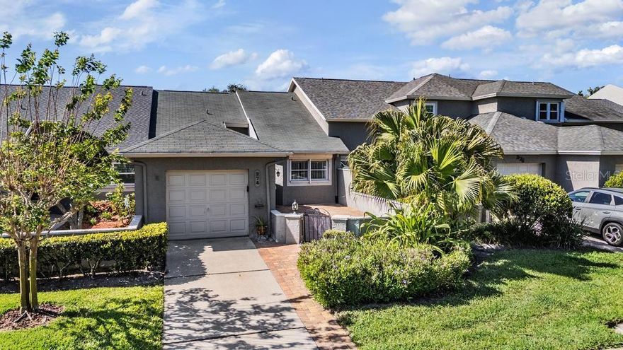 Charming 2-bedroom, 2-bath villa with 1-car garage in the desirable Steeplechase community of Palm Harbor! This 1,100 sq ft villa features an open living/dining area with vaulted ceilings and sliders leading to an enclosed rear porch. The eat-in kitchen offers a sunny breakfast nook overlooking a private, paver courtyard with gate, perfect for relaxing or entertaining.

Split-bedroom floor plan provides privacy, with a spacious primary suite featuring a walk-in closet & ensuite bath with walk-in shower, while front bedroom overlooks the courtyard and is adjacent to the hall bath.

Low monthly fee of $240 covers lawn care, trash, cable/internet, exterior painting, and community maintenance. Amenities include pool, tennis courts, and covered gathering area. Pet-friendly, all-ages community with desirable Palm Harbor schools  & conveniently located near shopping, dining, medical facilities, and just minutes to beautiful Gulf beaches!