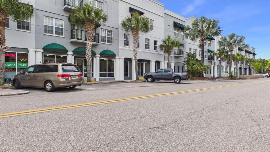 Top-floor. Two true en-suite bedrooms. Downtown Oldsmar at your doorstep. Welcome to Unit #324 at the Oldsmar Galleria — a move-in-ready, corner of Pinellas County where thoughtful updates, a smart layout, and a walkable lifestyle come together.

Step inside to an open floor plan dressed in fresh interior paint, brand-new carpet, and ceramic tile flowing through the main living spaces. The kitchen is built for real life — a welcoming breakfast bar for morning coffee or casual conversation, an appliance suite including refrigerator, dishwasher, built-in microwave, and disposal, and clean sightlines into the 20x13 living room that anchors the home. 

From your private balcony on the top floor — the third and highest level — take in mixed downtown views and the easy Florida breeze. The balcony functions as a true outdoor extension of the living area: a morning coffee perch, a sunset lounge, a quiet place to exhale at the end of the day.

And then there's the neighborhood. Downtown Oldsmar has quietly become one of the Bay Area's most charming small-town-feel destinations — walkable streets, R.E. Olds Park on the shoreline of Old Tampa Bay, Oldsmar library, the Farmers Market, local cafés and restaurants, and year-round community events that turn neighbors into friends. You're minutes from the Veterans Expressway, an easy drive to Tampa International, and well-positioned for Westshore commutes or a spontaneous Gulf beach day.