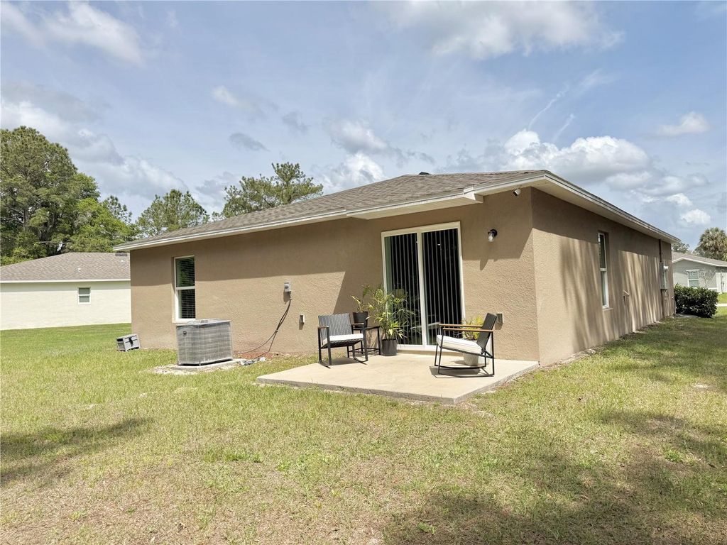 Photo of 597 Live Oak Loop, Crescent City, FL 32112 (MLS # O6405003)