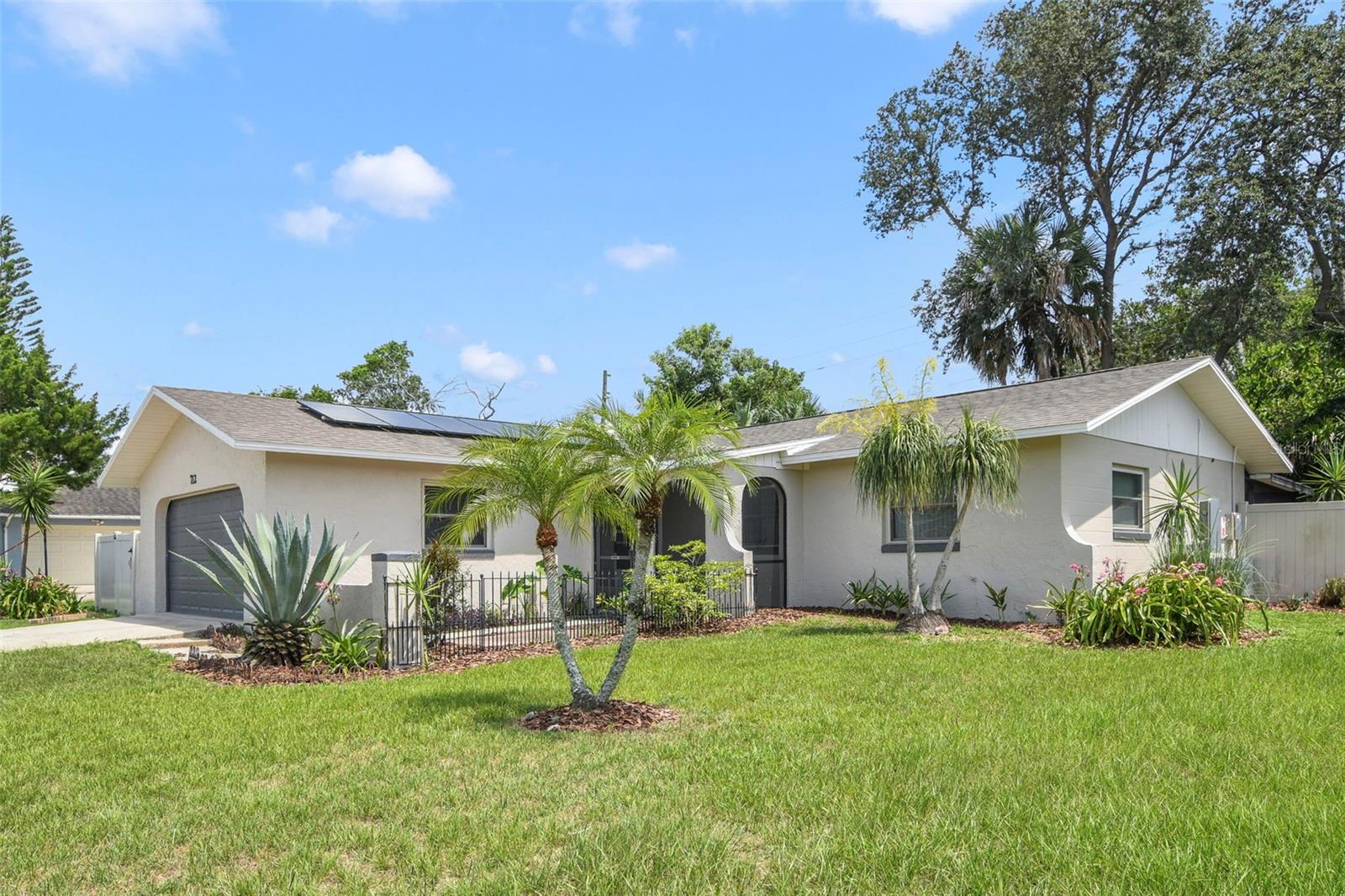 Beautifully Updated 3-Bedroom Pool Home with Solar Power & Scenic Pond Views in Longwood, FL
Welcome to this stunning and energy-efficient 3-bedroom, 2-bathroom home nestled in the heart of Longwood, Florida. Blending style, comfort, and sustainability, this residence offers an inviting retreat in a peaceful neighborhood zoned for top-rated Seminole County schools.
From the moment you arrive, the charm is undeniable. A gated front entry leads to a screened-in front porch, offering a perfect spot to relax and enjoy the Florida breeze. Inside, you’ll find a bright and open layout with luxury vinyl plank and tile flooring throughout. The remodeled kitchen (2014) is both stylish and functional, seamlessly connecting to the living and dining areas—ideal for entertaining and everyday living.
Step outside to your private, fenced-in backyard oasis, where a sparkling pool with a durable PebbleTec finish invites endless summer fun. The screened-in covered lanai provides the perfect shaded spot to unwind while enjoying your weekends and afternoons. A dedicated dog run offers convenience for pet owners, while the vinyl fencing ensures privacy and security.
Sustainability meets modern living with fully paid-off solar panels, complete with a 25-year warranty and two high-capacity battery backups valued at $75,000. A cutting-edge 85-gallon hybrid water heater adds to the home’s efficiency, making utility savings a major perk. The roof was replaced in 2019, and fresh interior and exterior paint make this home feel brand new.
Additional comforts include a spacious 2-car garage, a mounted 55” TV in the primary bedroom, and an included washer and dryer for your convenience. Whether you’re lounging poolside, taking in the serene views, or exploring the nearby dog park, playground, pickleball and tennis courts, baseball and basketball fields, picnic areas, and walking trails, this home truly has it all.
Move-in ready and thoughtfully upgraded, this Longwood gem offers the perfect balance of modern amenities and peaceful Florida living.