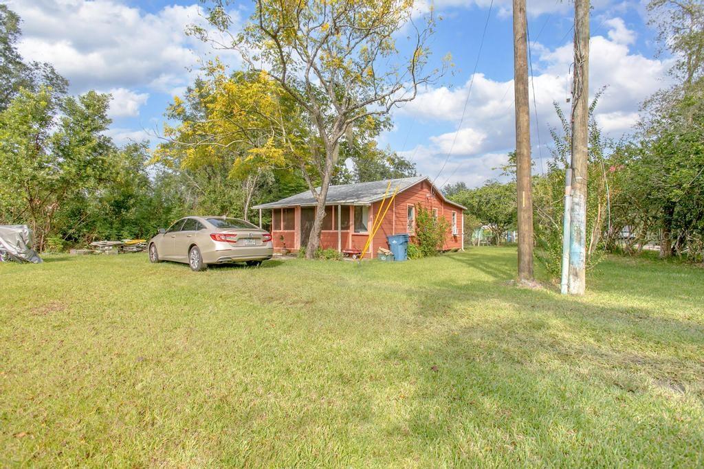 DeLand - A tiny home community of your own, with room to grow! All 5 units are conveniently located near shopping, transportation, downtown, hospital and major highways. This private and secluded location has units: 3 has 1/1., 1 has 2/1 and a duplex each with 1/1. They share septic and water, electric metered separately. These homes were built during simpler times.This parcel has 2.11 acres and zoned multifamily. Let your imagination lead you to bring out the beauty and uniqueness of this well priced opportunity!
