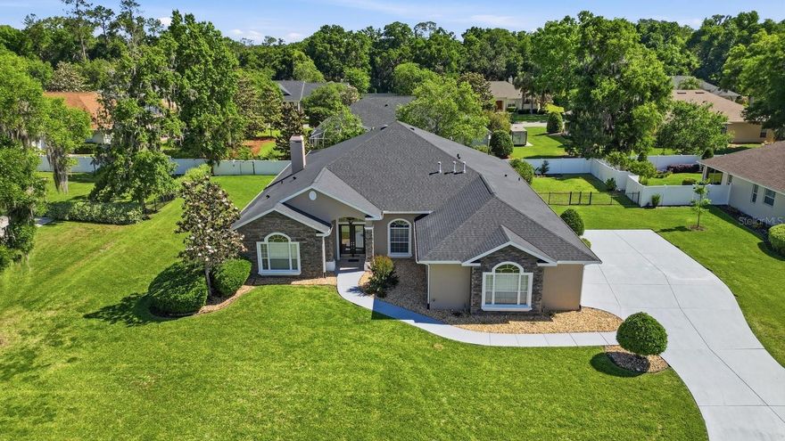 One or more photo(s) has been virtually staged. Welcome to this Custom-Built Elegant Home in the Desirable Gated Community of Laurel Wood in SE Ocala! Winner of the 2002 Parade of Homes, this Stunning 4-Bedroom, 3-Bath Residence offers 3,606 sq ft of refined living space, including an Office/Den and a Bonus Study Room perfect for homework, hobbies, or additional workspace. From the moment you enter, you are welcomed by Soaring High Ceilings and a Beautiful View of the Gorgeous Foyer and Living Room, enhanced by elegant porcelain tile flooring. Situated on a Spacious 0.47-Acre Fenced Lot, this home features Beautiful Curb Appeal with Stone-Accented Exterior Walls, Fresh Exterior and Driveway Paint, rain gutters, and an Oversized Side-Entry 3-Car Garage.
Inside, you’ll find a Thoughtfully Designed Floor Plan with No Carpet, Updated Flooring for the Bedrooms and Closets in 2023, Elegant Tray Ceilings, Custom Molding Details, and abundant natural light throughout. The Gorgeous Family Room showcases a Gas Fireplace, Decorative Tray Ceiling, and Expansive Windows Overlooking the Enclosed Heated In-Ground Pool. The kitchen offers Granite Countertops, Updated Hardware and Lighting, a Stainless-Steel Sink, Newer Smart Refrigerator and Dishwasher, and a Spacious Island with Cooktop and Built-In Downdraft Ventilation for a clean, streamlined look.
The Private Primary Suite is a true retreat with its Own Gas Fireplace, Double Tray Ceiling, and a Beautiful Bay Window overlooking the pool area. Two guest bedrooms share a convenient Jack & Jill Bath, each with its own vanity area and a shared bath/shower space. The 3rd Bath is a Perfect Pool Bath with a close proximity and separate access door to the outside area. Enjoy Year-Round Outdoor Living in the Screened Pool Area, featuring Gas Heat and New Pool Equipment.
Major updates include Roof 2022, Two AC units (main 2021 and primary suite 2023), Water Heater 2021, smart refrigerator 2021, dishwasher 2021, Whole-House Water Softener, Generator Plug, Electric Car Plug, and more. A rare opportunity to own a Beautifully Maintained Custom Home in one of SE Ocala’s sought-after gated communities! Select interior photos have been virtually staged to showcase the home's design potential. Actual room photos are also included. Schedule Your Private Showing today!