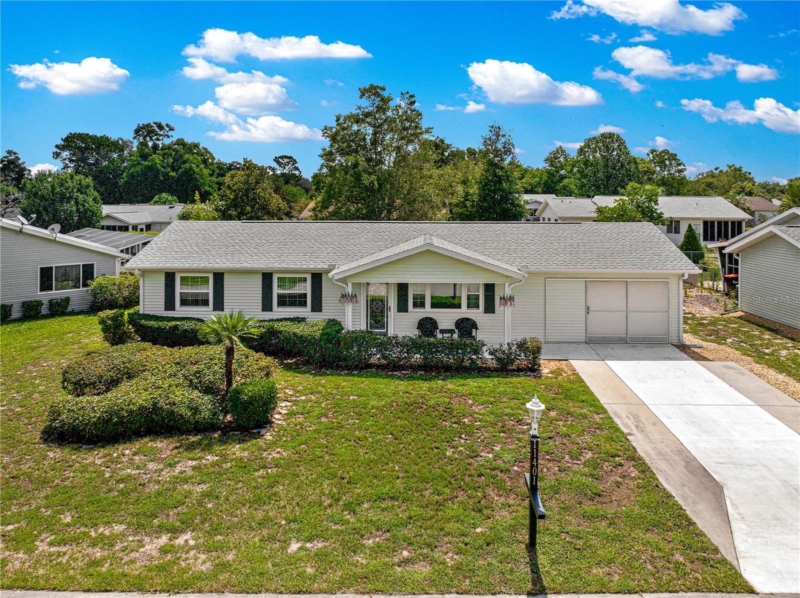 You have found your next home! This is the popular 2/2 Savannah model is move-in ready. When you walk through the decorative leaded glass front door, you will immediately notice the openness of the floorplan and the light and bright feel. This home offers 1,000 sq ft of living space, NOT including the lanai that is also under heat and air, plus a 120 sq ft grilling patio. NO CARPET, tile in the kitchen, dining room, bathrooms and the lanai, wood look plank vinyl in the bedrooms and living area. The kitchen boasts a full suite of stainless appliances including the glass top stove, built-in microwave and dishwasher, there is a window over the sink offering additional light and lots of cabinetry. The primary suite is large and has an ensuite bath with step-in shower, a dressing vanity area right outside of the large walk-in closet. The guest bath features a tub/shower combo. Other improvements include a new roof in 2021, a retractable screen door on the garage, and the driveway has been widened. New Electrical panel will be installed before closing. The location inside of Oak Run is perfect, super convenient to the back entrance of the community onto 484, making the drive to go shopping and to restaurants a breeze. Oak Run is a premier 55+ community featuring 6 pools, one indoor and one Olympic sized, Tennis, Shuffleboard, Bocce, tons of clubs and more. Enjoy Golf? The Royal Oaks Golf Club is for you - it is an 18 hole, par-72 course that you won't want to miss. This community is close to shopping, medical, restaurants and more.
