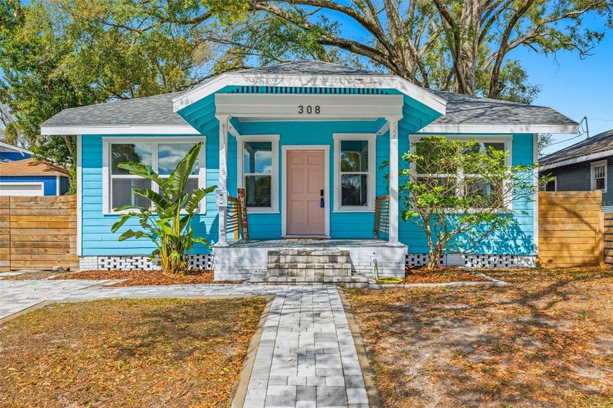 Tucked inside the North Park subdivision of Seminole Heights, this beautifully updated 3 bedroom, 2 bathroom bungalow blends historic charm with thoughtful modern updates in one of Tampa’s most loved neighborhoods. With tree-lined streets, local coffee shops close by, and quick access to everything that makes Seminole Heights special, this is the kind of home that just feels right the moment you drive up. As you arrive, you’ll notice the classic bungalow curb appeal, complete with a covered front porch that practically begs for morning coffee. A brick paver parking pad provides convenient off-street parking, and the home sits in Flood Zone X for added peace of mind meaning no flood insurance is required. Built in 1922 and beautifully renovated over the last few years, this home offers over 1,200 square feet of stylish, functional living space. Step inside and you’re greeted by vinyl plank flooring in the main living areas and bedrooms, and decorative tile in the bathrooms and laundry room. The living and dining room combination creates an open, easy flow for everyday living and entertaining. A decorative fireplace with brick anchors the space and adds character, while updated lighting and a ceiling fan in the family room elevate the design. The kitchen flows seamlessly into the dining and living room and truly serves as the heart of the home. Quartz countertops, white shaker-style cabinetry, a white tile backsplash, and an under-mount sink create a clean, timeless look. You’ll love the stainless steel range hood and appliances, pot filler, built-in mini wine fridge, and functional open wall shelving. The primary bedroom offers a peaceful retreat with an ensuite bathroom featuring a glass-enclosed shower with beautiful floor to ceiling tile work. The secondary bedrooms each include ceiling light, and one bedroom showcases a decorative fireplace with tile for added charm. The secondary bathroom has a tub/shower combo with the same modern finishes you expect to see. The laundry room features stylish tile flooring and even includes a built-in pet spa area for washing furry friends. Newer French doors lead out to a wood deck and into the backyard, making indoor to outdoor living effortless. Out back, you’ll find a large, fully fenced yard with plenty of room to entertain or simply unwind. A shed with electricity and AC provides excellent additional storage or workshop space. The washer and dryer convey, and major updates include a 2021 A/C, 2022 and 2023 double-paned windows, a 2024 roof, a 2025 Rheem electric tankless water heater, and 2025 blown-in attic insulation. Living in Seminole Heights means you’re surrounded by some of Tampa’s favorite local spots. Grab dinner at Rooster & the Till, meet friends at Front Porch & Bart's Tavern, or enjoy fresh seafood at Trophy Fish. Coffee lovers will appreciate stops like Spaddy’s Coffee Co. and DI Coffee Bar, while foodies can explore favorites like Ichi Koroshi Ramen and Smashburger. Everyday conveniences like Publix and local gems such as Seminole Heights Garden Center are just minutes away. The ZooTampa at Lowry Park is nearby, or enjoy a short drive to I-275, offering easy access to Downtown Tampa, Ybor City, and Channelside, making commuting, dining, and nights out incredibly convenient while still enjoying the charm of Seminole Heights. Make this your new home, and schedule your showing today!