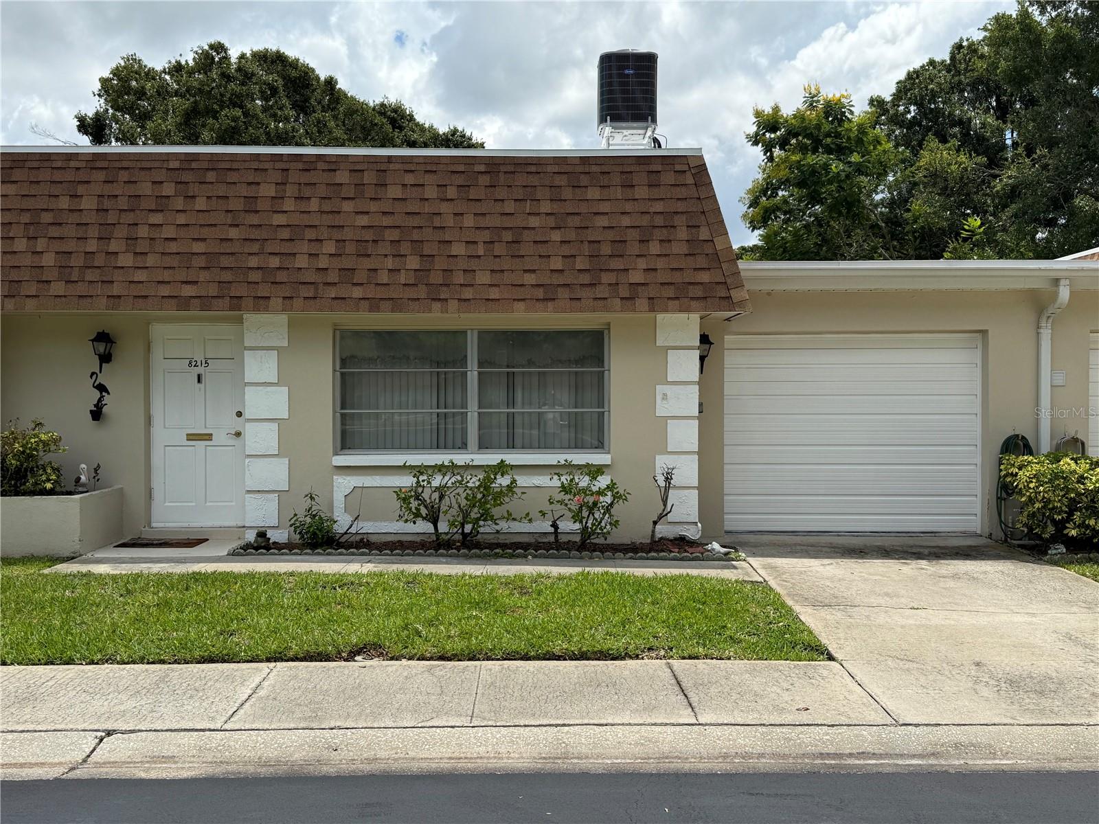 Come see this quaint spacious villa offering plenty of storage! This quiet 55+ community offers shuffleboard, community pool, and a clubhouse. Beautiful 1 BR /1.5 Baths well maintained Villa with attached 1 car garage and BONUS room comes FULLY FURNISHED! A NEW roof (June 2025), NEW AC (2024), NEW ceramic tile (2023) throughout the entire living area, NEW Patio pavers (2024), and an updated electrical panel (2021) are just some of the upgrades that you will find in this beautiful villa, that is as clean as can be! This villa sits on a premium lot as you will step out and enjoy the privacy of having NO rear neighbors - great open space with all of the greenery and a great view of the community pond at a distance! This Villa is a one floor unit which means no noisy upstairs neighbors.HOA fees INCLUDE roof, cable, internet, exterior maintenance, cable, water, sewer, trash, escrow reserve fund, pool maintenance - YOU ONLY have to worry about electricity! Close to everything you could want, yet off the beaten path and tucked away. Convenient central Pinellas location with short drives to beaches and shopping areas.