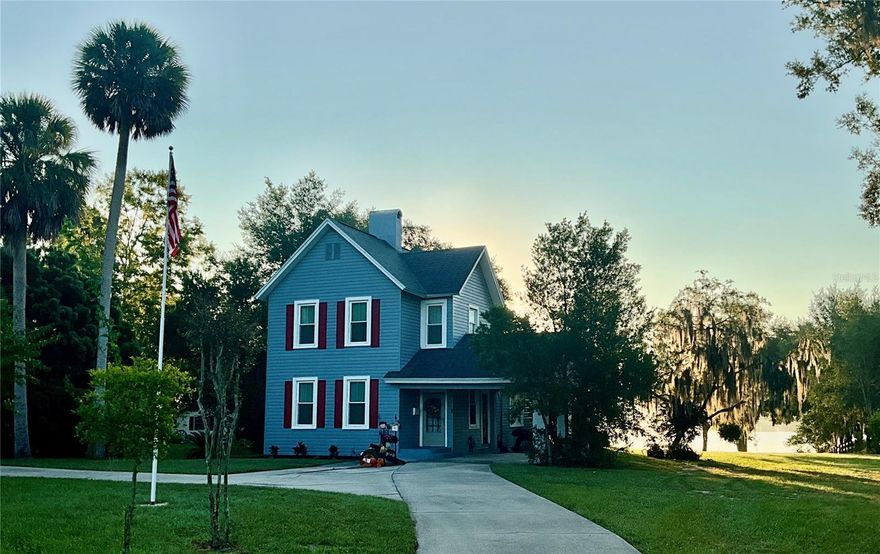 Unique Lakefront Colonial with Pool & Guest House in Downtown Umatilla
Built in 1875, this rare colonial-style home is full of character and old-world charm—truly not a cookie-cutter house. Set on 1.63 acres directly on Lake Umatilla, it features a private dock with electric service, boat lift, and jet ski lift.
The main home offers 3 bedrooms and 2 baths, with a downstairs suite and two bedrooms upstairs sharing a full bath. Distinctive details include 10-foot ceilings, crown molding, vintage glass doorknobs, and a working vintage-style elevator.
The detached 1-bedroom, 1-bath guest house with attached workshop would be a great rental or small business.  Recent updates include: Electrical, Plumbing, Kitchen; downstairs bathroom; exterior paint, roof (2018), and front windows; plus A/C units (2014 & 2015).
Perfect for entertaining, you can host gatherings by the pool, grill on the deck, and enjoy boating, fishing and skiing on the lake. Zoned Residential/Professional, this property also offers potential for a home-based business or office. Convenient to Umatilla Airport, with the occasional seaplane landing right on the lake.