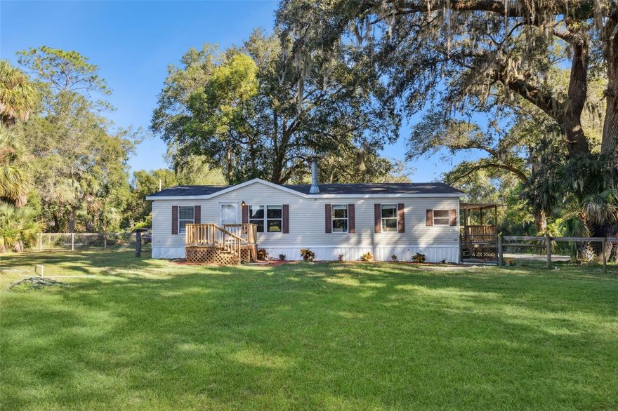 MOTIVATED SELLER!! Welcome home to country living on over 6 acres!! As YOU walk thru the front door you'll be amazed by the spacious living room featuring a wood burning fireplace perfect for those cool FL nights we have coming soon! This open floorplan is ideal for entertaining, the dining area has plenty of room for your big dining room table for the holidays. Off the dining area will be the kitchen offering plenty of cabinet space and the cabinets have a beautiful glass detail. A cooks dream of a gas stove and stainless dishwasher, refrigerator and microwave appliances. The master suite has plenty of room for a king bed and features a soaking tub, double sinks and a walk in shower! Also a split floor plan too!! Other two bedrooms have plenty of natural light and secondary bathroom is ideal for guests. Outside is a dream with a horse barn and a pull barn built in 2021!! Fitting for all the farm animals as this property is zoned A1. The side porch is the ultimate for enjoying the sunshine and nice weather. Pond view as well! Roof 2018, A/C 2024, new drain field, new well pump and bladder tank and new iron filtration system. Wow! Schedule a showing today as this home won't last long! Seller willing to contribute $5,000 towards buyers closing costs!