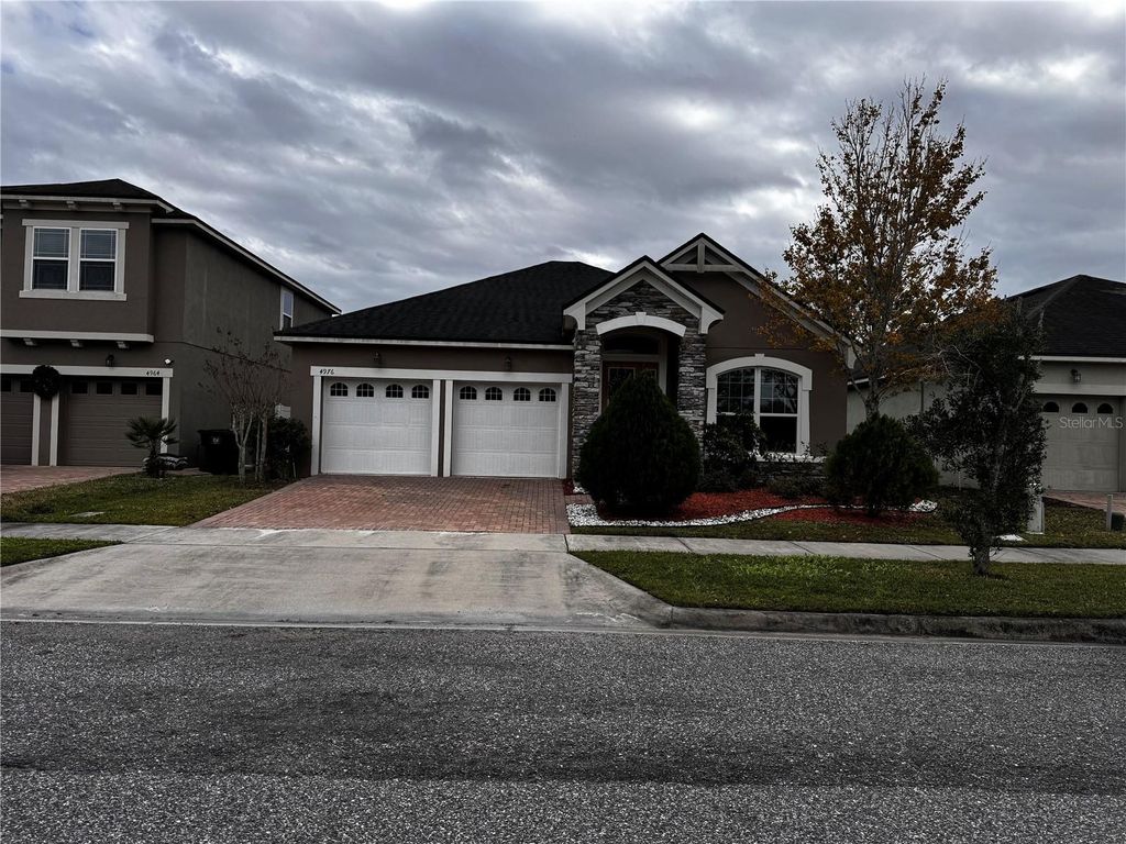 Photo of 4976 Millennia Green Drive, Orlando, FL 32811 (MLS # O6367617)