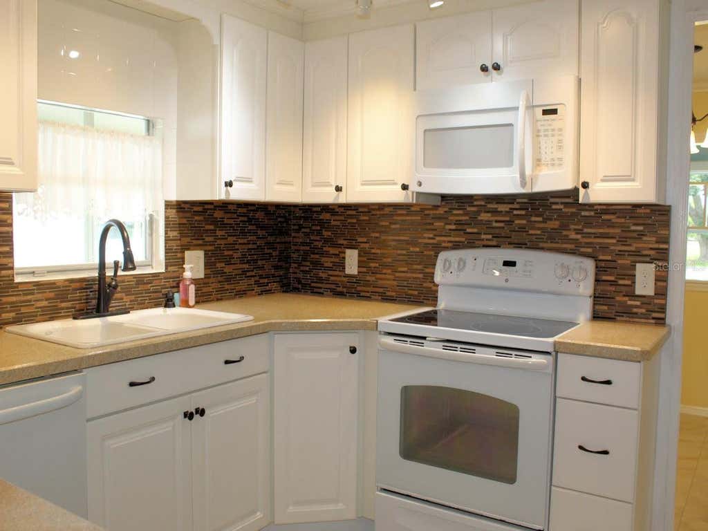 Photo of 92 Thatch Palm Street E, Largo, FL 33770 (MLS # TB8537254)