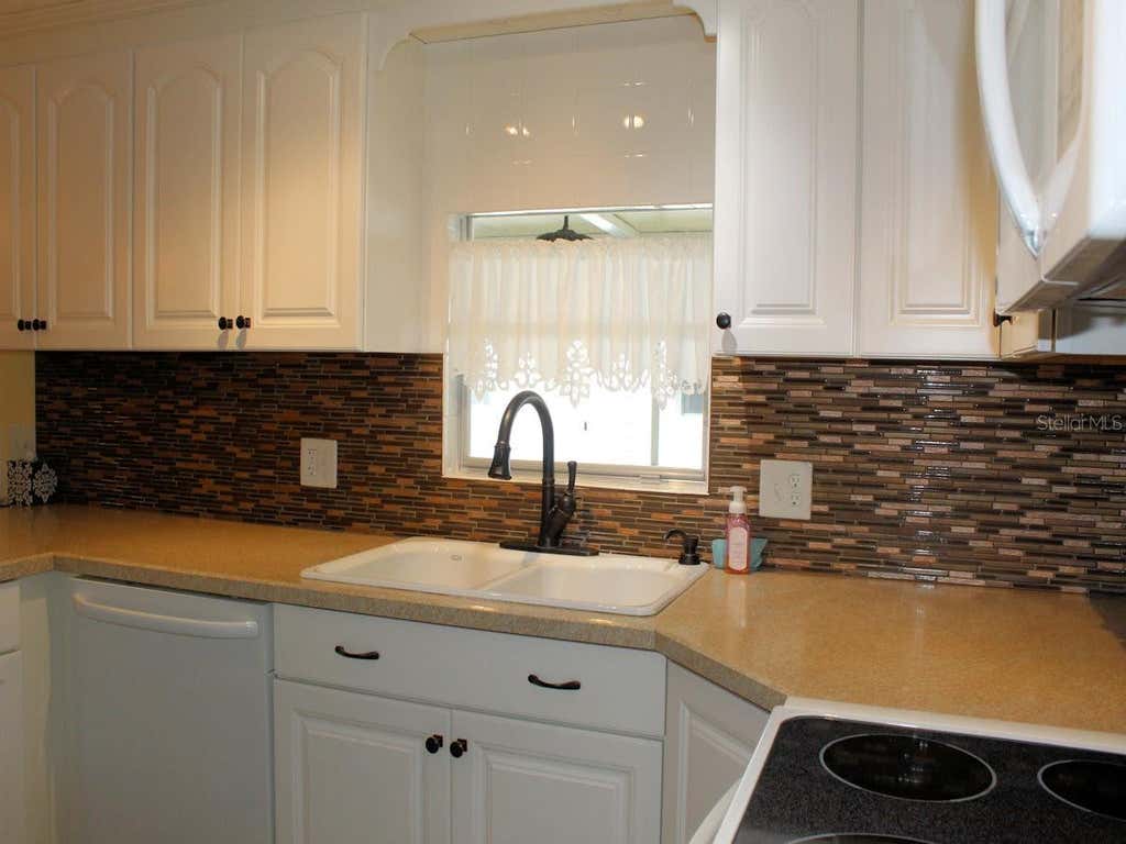 Photo of 92 Thatch Palm Street E, Largo, FL 33770 (MLS # TB8537254)