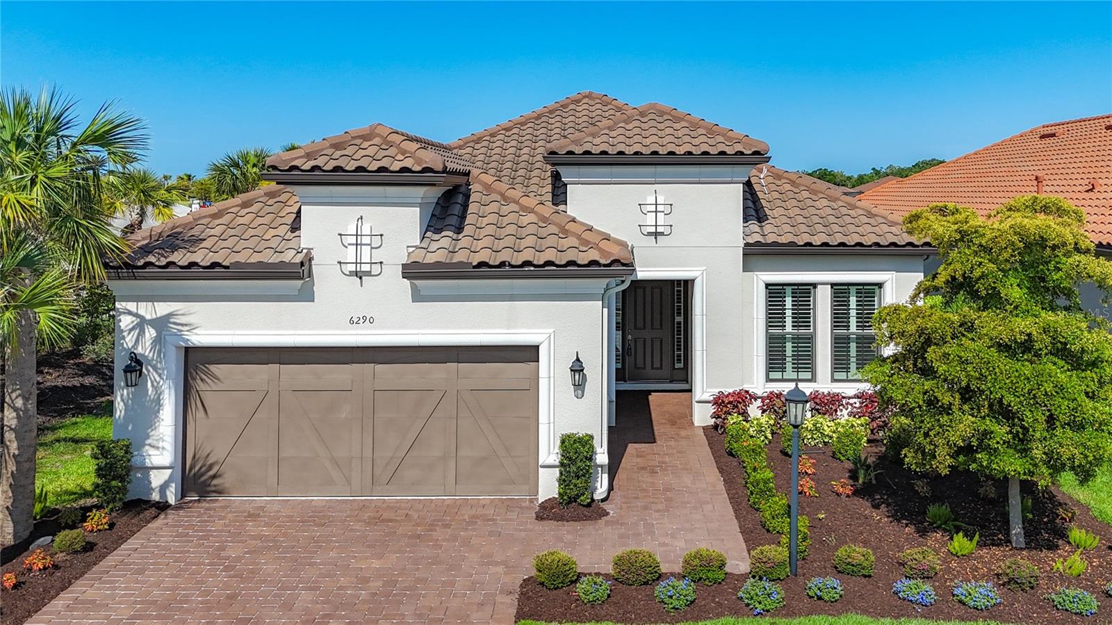 Rarely Available Lazio Model by Taylor Morrison
Esplanade at the Heights – Sarasota, FL
Step into luxury living with this rarely available and highly sought-after Lazio model loaded with many builder upgrades, expertly built by Taylor Morrison. Designed with both elegance and everyday functionality in mind, this spacious home features three generously sized bedrooms, a versatile den or home office, three full bathrooms, and a two-car garage with one stall with a tandem option to store an additional car, plus the garage has a separate A/C unit. The garage also has a hanging wire storage platform that can hold up to 600 lbs, offering the perfect blend of comfort, style, and convenience.
Located in Esplanade at The Heights, a premier gated community, residents enjoy an exclusive resort-style lifestyle with access to:
Tennis & Pickleball Courts
Community Pool
State-of-the-Art Fitness Center
Recreation Center with social and wellness activities
The home boasts 10-foot ceilings and 8-foot interior doors, enhancing the open and airy ambiance. At the heart of the home lies a chef-inspired gourmet kitchen featuring 42-inch wood cabinetry, a large quartz center island, gas cooktop, and convection oven—perfect for entertaining, gas clothes dryer. The kitchen overlooks a heated saltwater swimming pool and spa , outdoor kitchen, gas fire pit, and concrete pavers in the lanai and pool area, creating an inviting space for outdoor living and gatherings.
The property is positioned on a premium end lot, providing added privacy and serene surroundings. Additional features include:
Whole-house generator for peace of mind
Motorized power blinds on the rear sliders
Custom walk-in closet in the primary suite by Closets by Design
Ample storage and a large, well-appointed laundry room
Meticulously landscaped exterior
The open-concept floor plan allows for a seamless flow of natural light throughout the home, creating a warm and welcoming environment ideal for both relaxing and entertaining. Step outside to explore the beautifully maintained community grounds, complete with wide, tree-lined roads, private walking trails, and breathtaking panoramic views of Sarasota from the hilltop.
Prime Location – Convenient & Connected
Perfectly situated just west of I-75 with easy access from Honore Avenue, Esplanade at the Heights sits in the heart of the vibrant University Parkway corridor, bridging Sarasota and Manatee Counties. The community is adjacent to Mote Ranch and just minutes from:
Palm Aire & University Park Country Clubs
Upscale shopping at Whole Foods, Fresh Market, Macy’s, Target, and Home Depot
A diverse selection of fine and casual dining
Renowned healthcare facilities
SRQ International Airport, Downtown Sarasota, Bradenton, Lakewood Ranch, and the University Town Center (UTC)
World-famous Sarasota and Manatee County beaches
Live the Life You Deserve
This exceptional Lazio model offers an unmatched combination of luxury, privacy, community, and location. Don’t miss this opportunity to own a home that defines Florida's lifestyle.