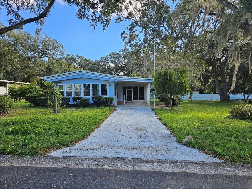 This 2 bedroom / 2 bath home is located in Lady Lake Oak Grove subdivision. This hidden gem of a 55+ community is peaceful and quiet with a LOW HOA of only $15/month! The home sits on .34 acre of property, so you are not "on top of your neighbor"! The home features a huge enclosed Florida room which adds a lot of room to the living space for the home, with Sliders from both the Living Room and Dining Room. The Kitchen offers Sliders to an enclosed, tiled and covered Lanai, perfect for all weather! The Kitchen also features a newer Stainless Steel French Door Refrigerator with Ice/Water in the door, and a smooth top Range. The Guest Bath offers a Walk-In Shower with safety seat. Tons of storage is also included with the home with a separate utility room with washer and dryer, and separate freezer, added storage behind the utility room, and a shed for all of your storage needs. The Living Room, Florida Room and Dining Room include laminate flooring with the Dining Room offering a built-in shelving and updated lighting fixture. The MasterBedroom includes 2 Master Closets (one a walk-in), and an En Suite Bathroom. The Master En Suite offers a walk-in jetted tub/shower combination and separate vanity area. The landscaping includes Oak Trees, Sago Palms, Bottle Brush and more....The community is centrally located near The Villages with shopping, restaurants, banks, medical facilities and so much more.