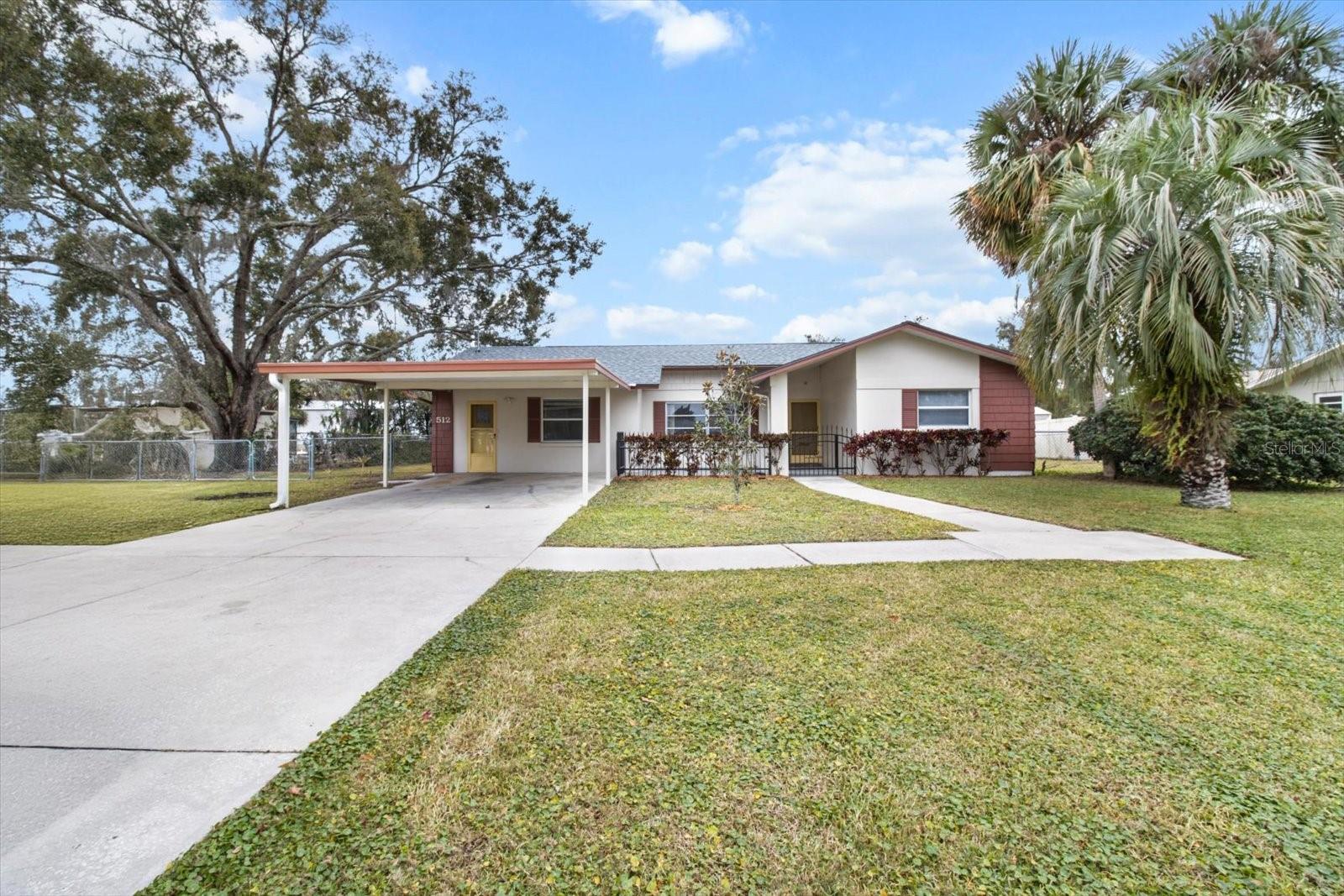This beautifully remodeled home is right in the HEART of golf cart friendly Crystal River! This 3 bedroom, 2 bath home has been completely updated and is located a short walk or golf cart ride to all of your favorite downtown shops and restaurants. The kitchen features Cambria Luxury quartz countertops, beautiful cabinetry and new appliances. Beautiful wood plank tile throughout the entire home. All three bedrooms are oversized and both bathrooms feature new vanities. This home features plenty of room to entertain friends and family. Large living room offers views of the newly (2023) screened in 12x31 lanai and fenced backyard. Kitchen/Dining combo space will become a wonderful gathering spot to share a warm meal. New roof in 2023, new AC in 2017. Fenced in backyard features mango trees. Screened in lanai has double screened doors so you can conveniently store your golf cart. Shed conveys for extra storage. Located about a half a mile to world famous Three Sisters National Wildlife Refuge, you can watch the manatees play in the beautiful crystal blue water. Enjoy all that this waterfront community has to offer, kayaking, boating, fishing, and lots of walking and biking trails. So much to see and do in this Award Winning city!