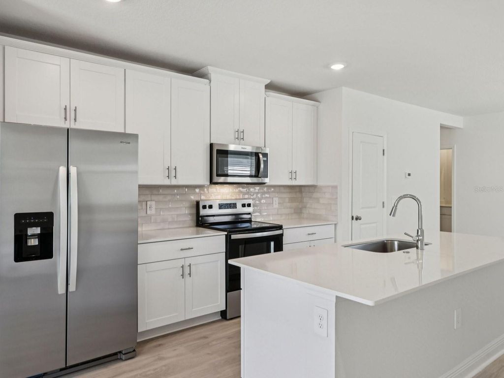 Photo of 803 Sunshower Drive, Lady Lake, FL 32159 (MLS # O6372019)